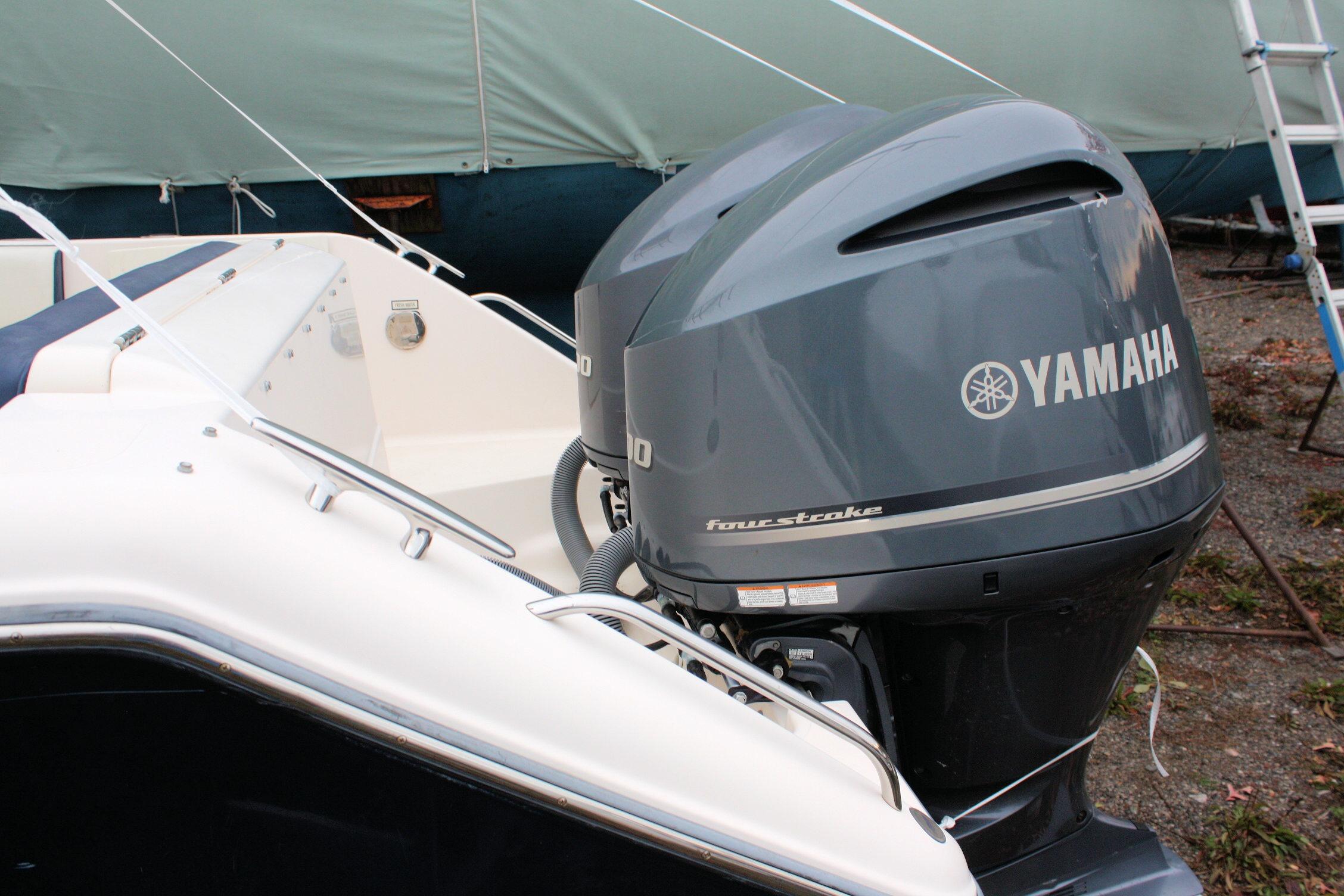 2013 Pursuit ST 310 Sport boat with Yamaha four-stroke engines.