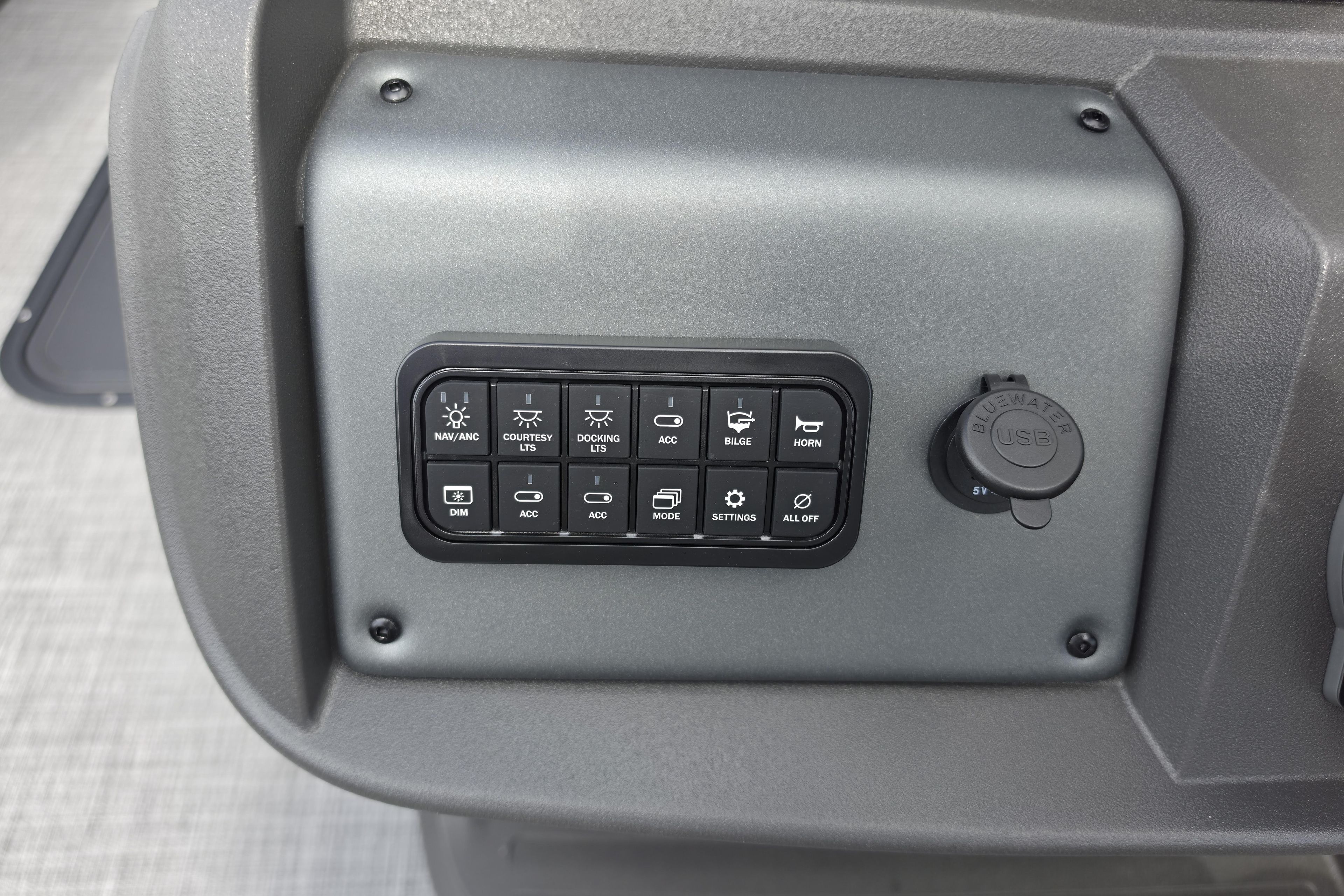 Control panel of 2026 Sun Tracker Party Barge 24 XP3 with USB port and switches.