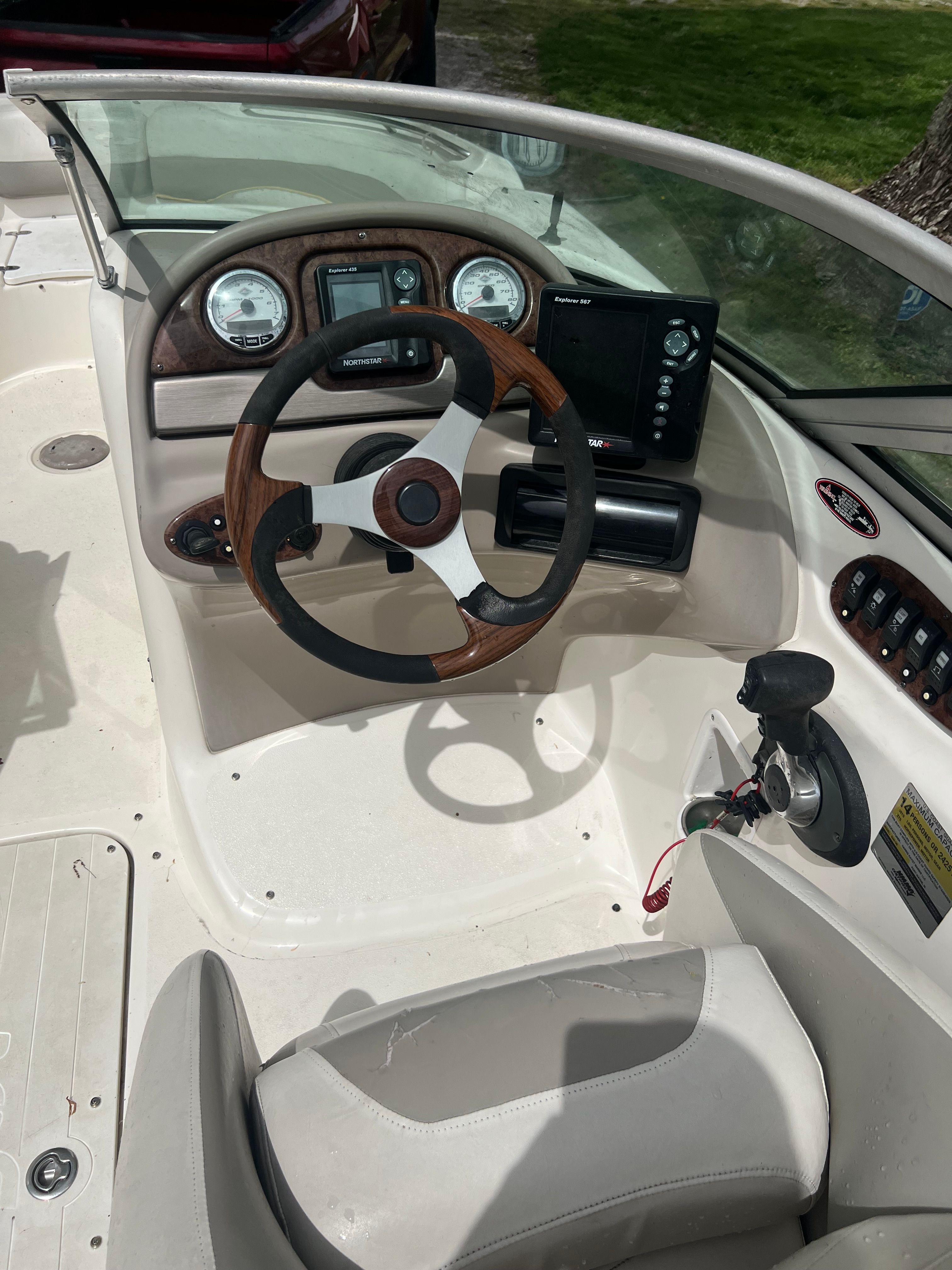Interior view of a 2007 Harris-Kayot S245 boat cockpit with steering and instruments.
