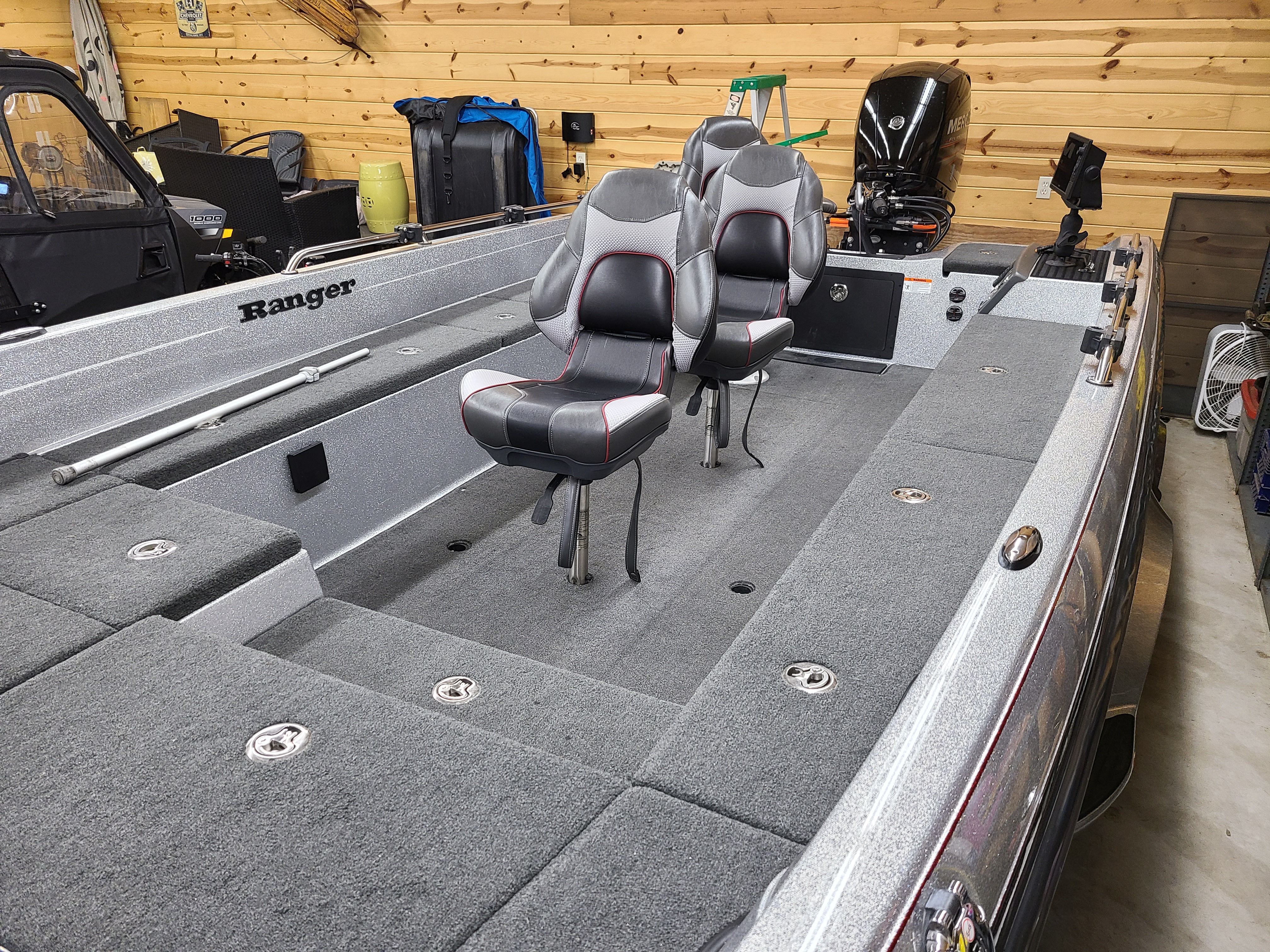 Interior view of a 2018 Ranger 620T Fisherman boat in a garage.