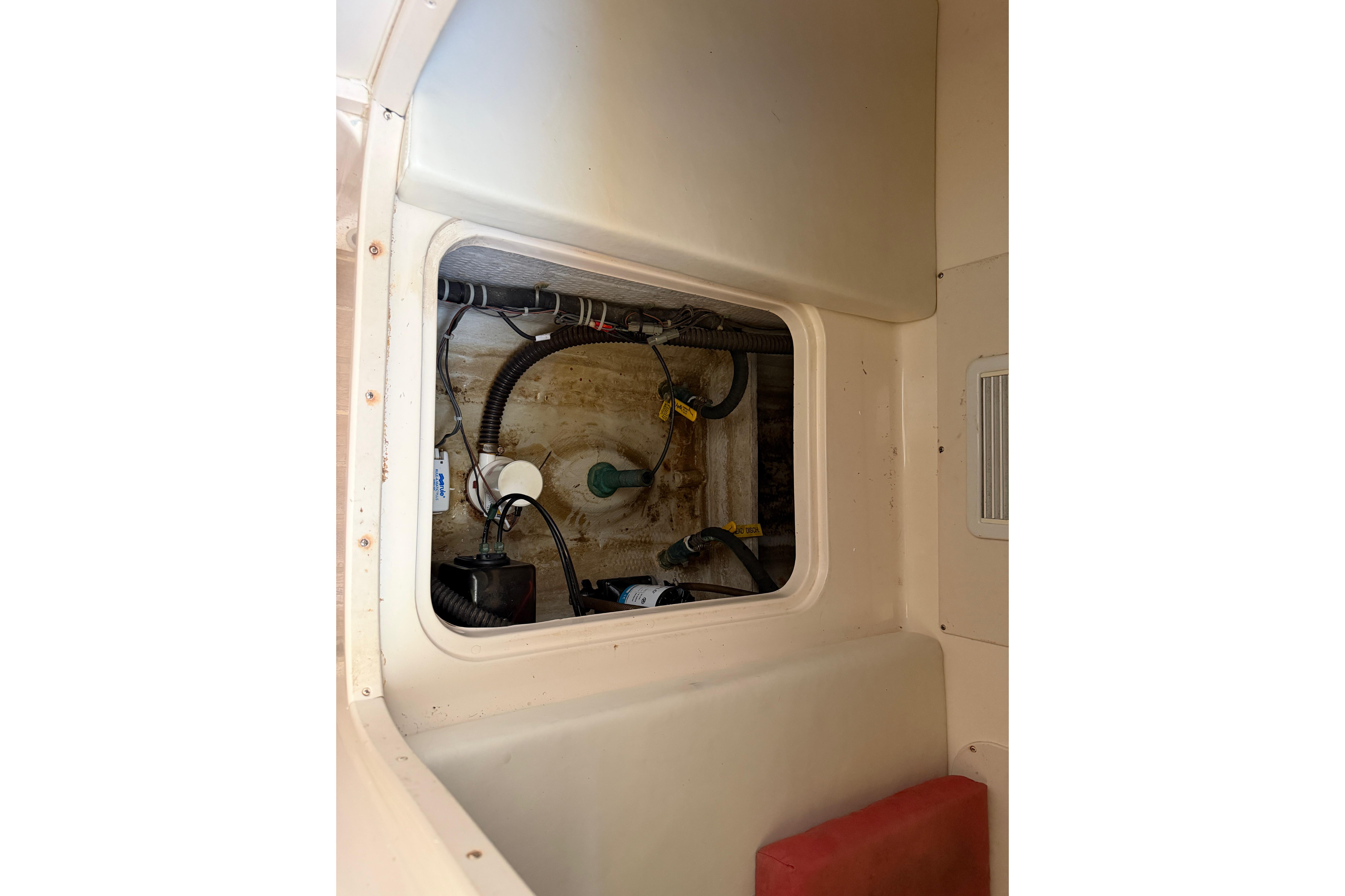 2006 Grady-White Sailfish 282 interior compartment with visible wiring and components.