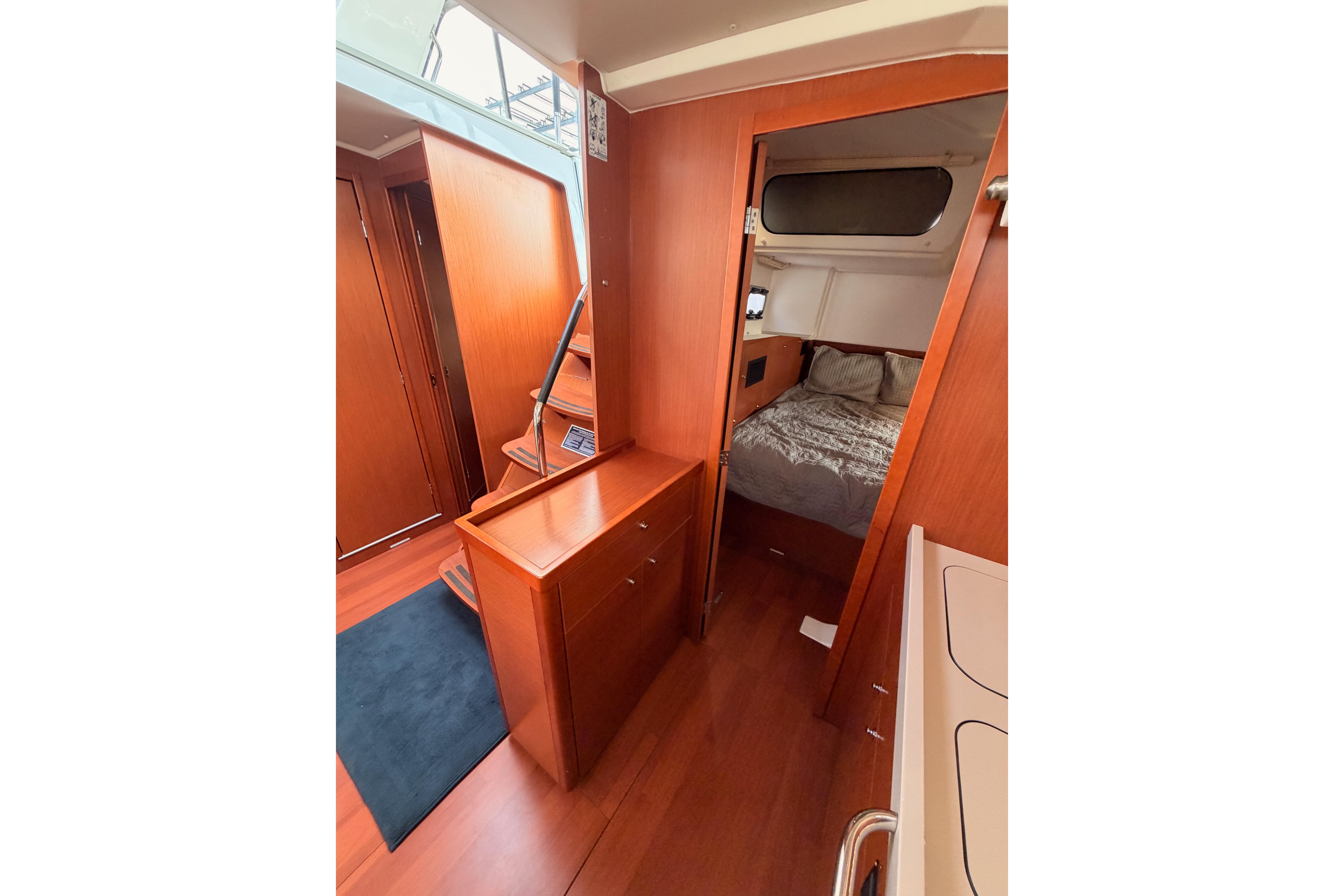 Interior of 2020 Beneteau Oceanis 46.1 yacht, featuring cozy cabin and wooden finishes.