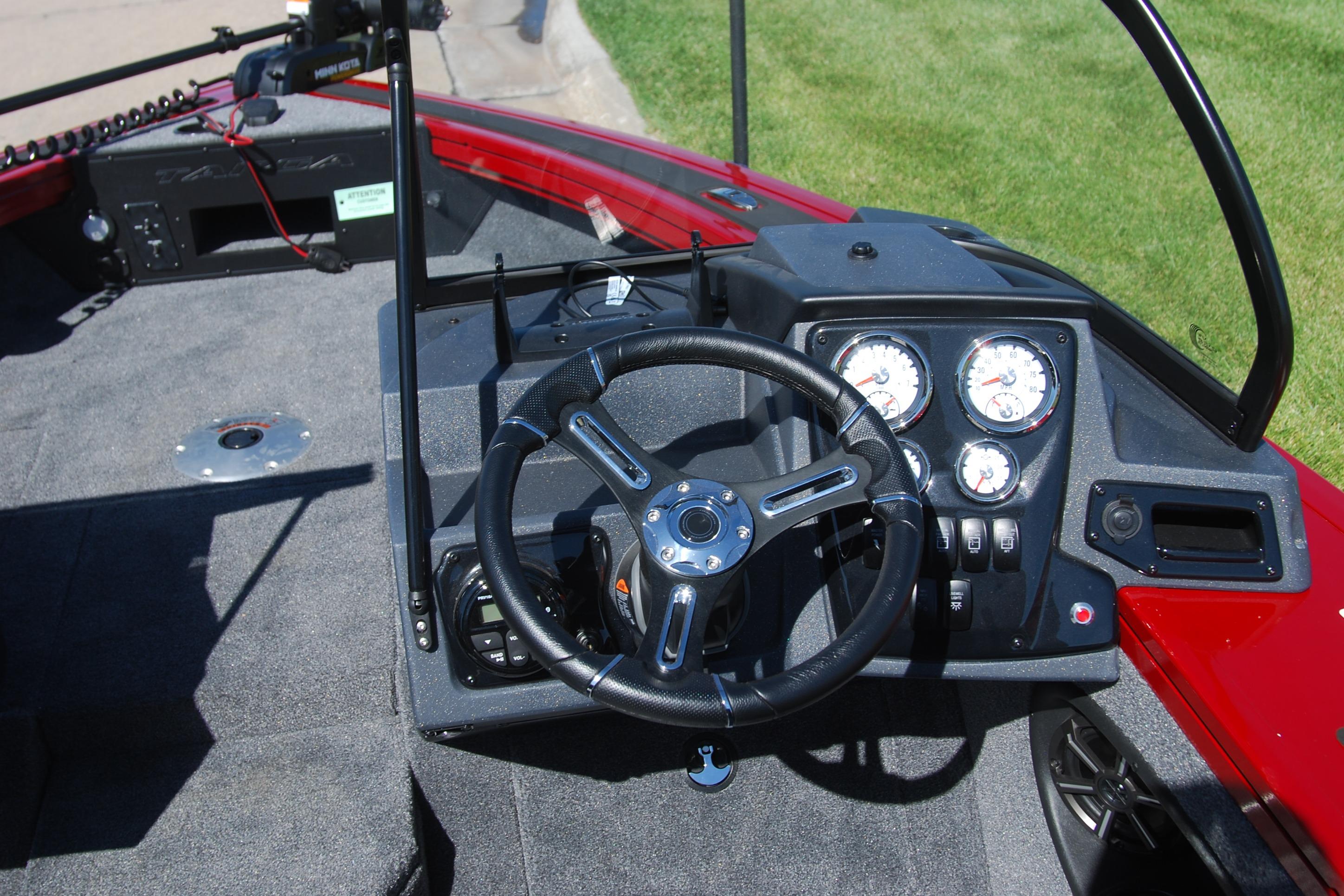 2026 Tracker Targa V-18 WT boat dashboard with steering wheel and gauges.