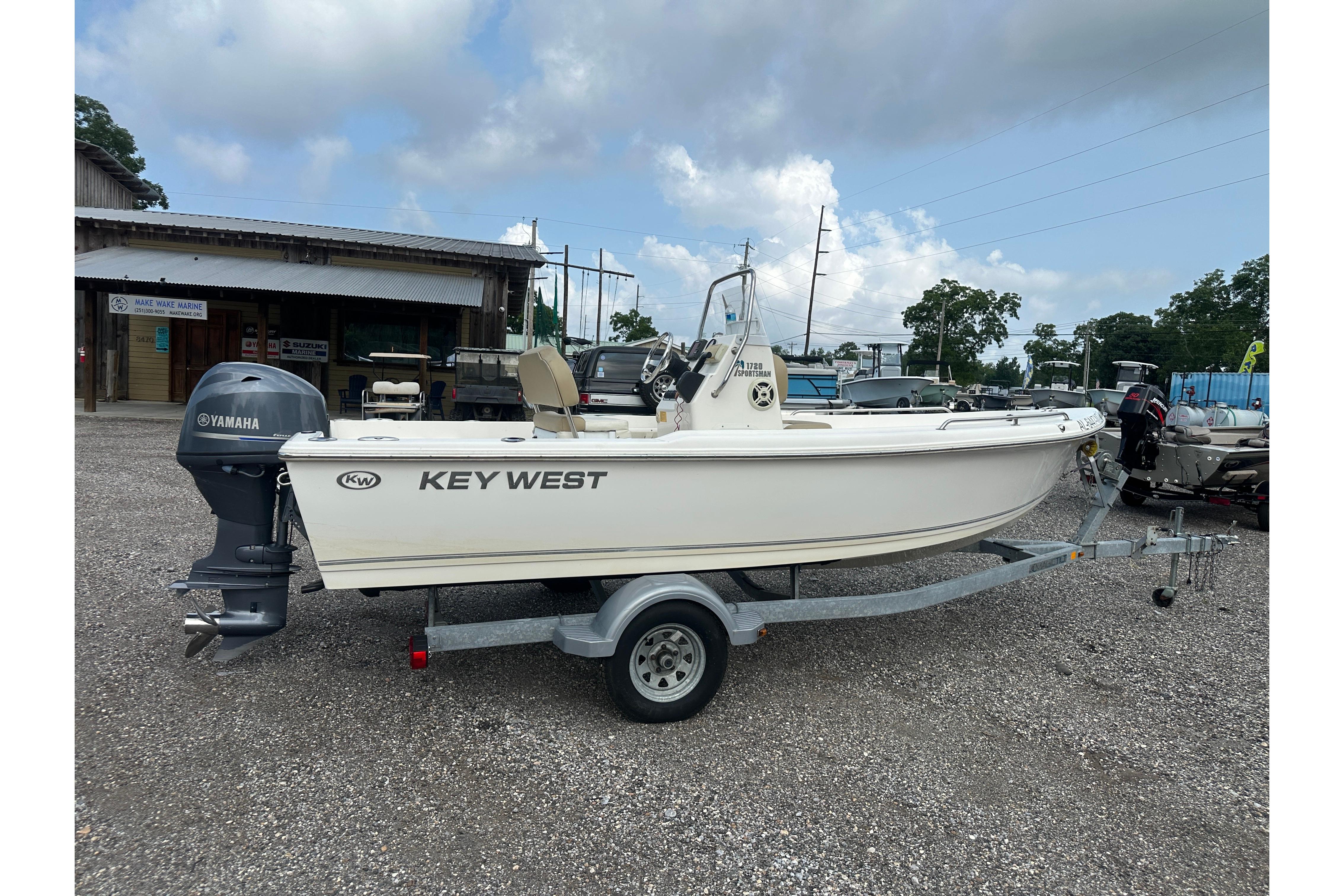 2018 Key West 1720 Center Console boat on trailer, parked outdoors.