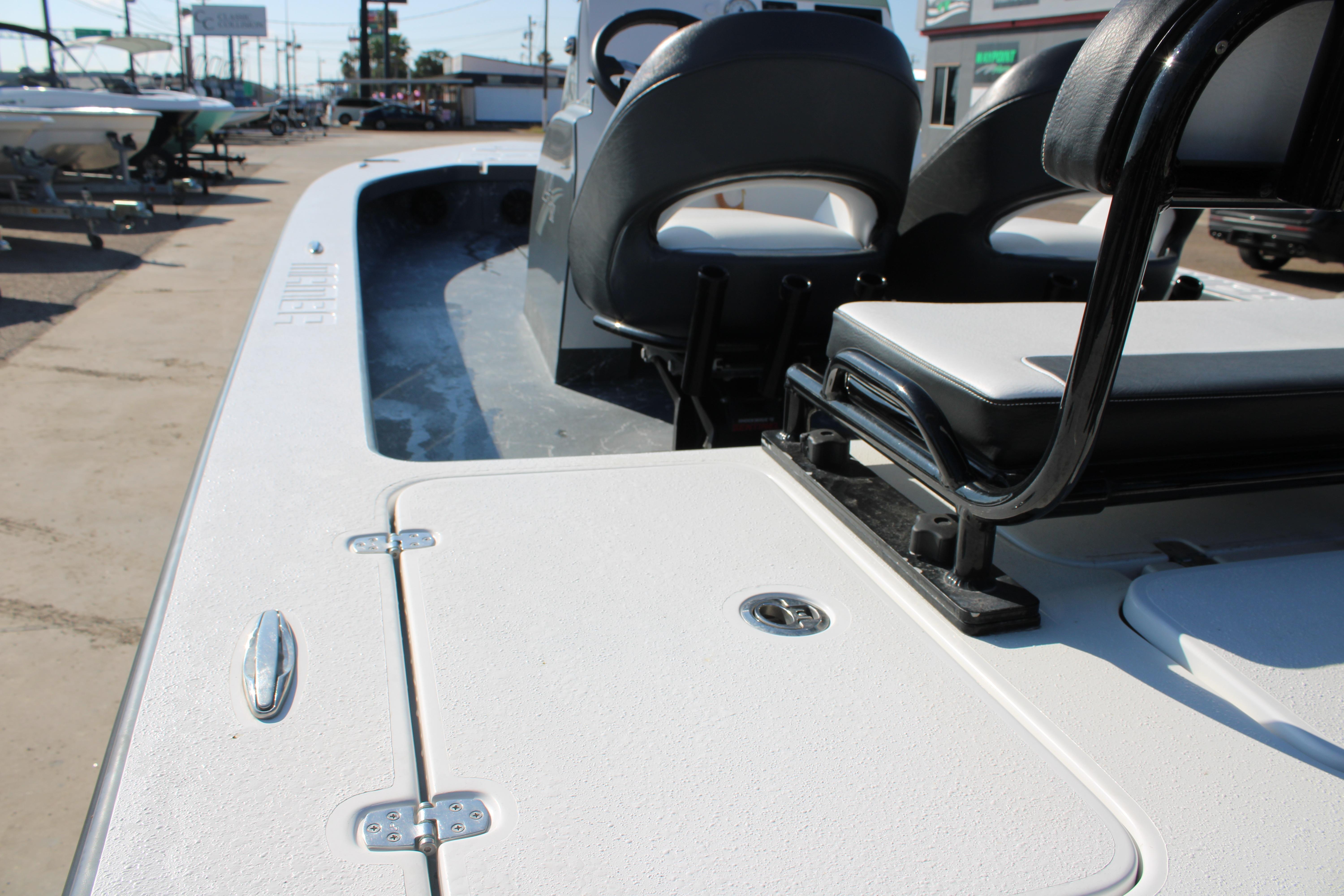2023 Mamba 24VX boat interior with seating and storage compartments.