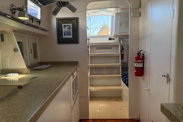 Interior of 2011 Reliance 44 yacht with modern kitchen and staircase.