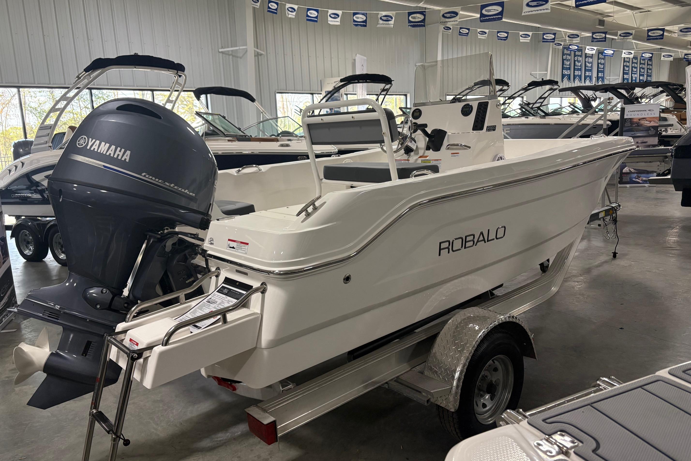 2026 Robalo R160 Center Console boat with Yamaha engine in showroom.