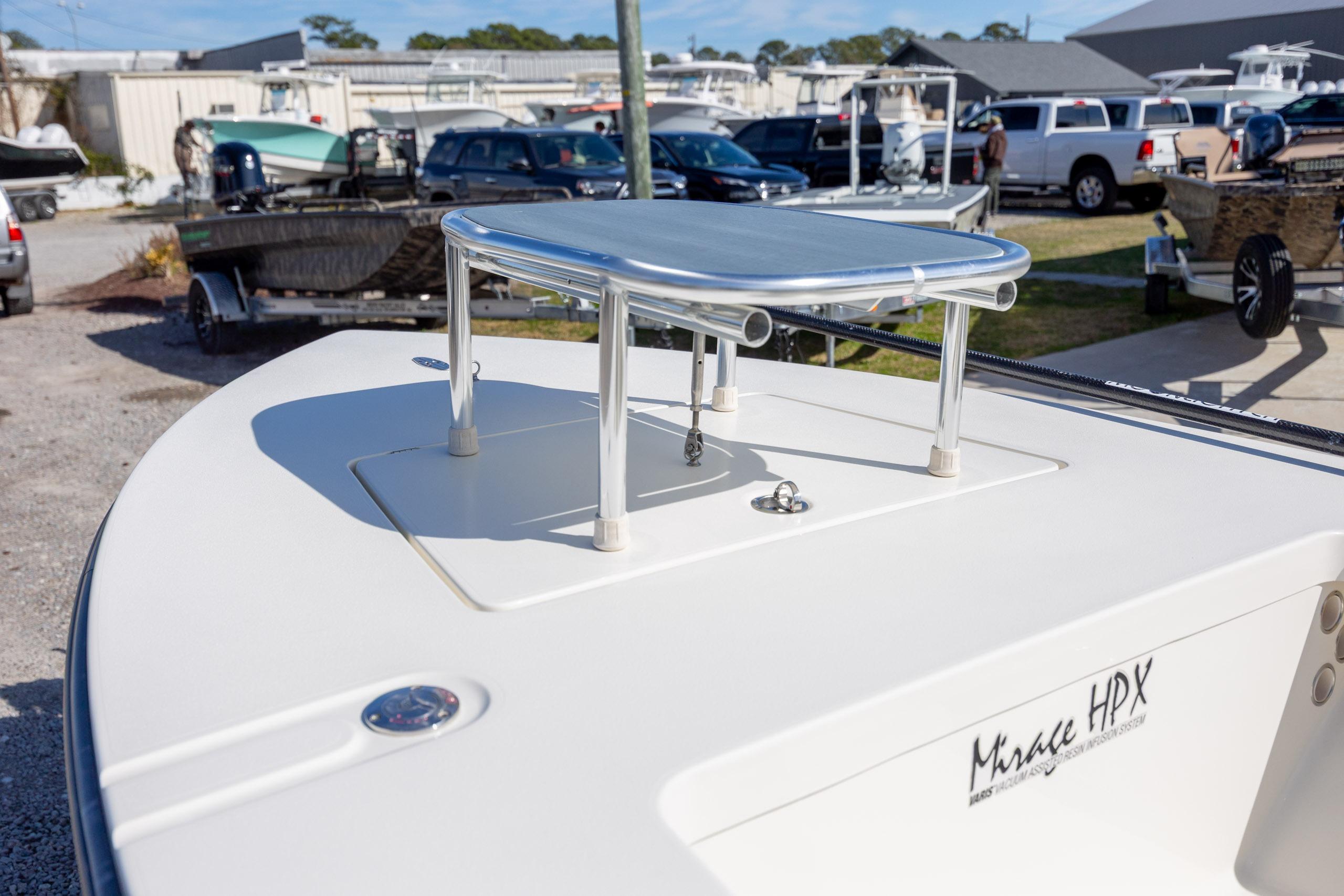 2024 Maverick 17 HPX-S boat deck with elevated platform in a marina setting.