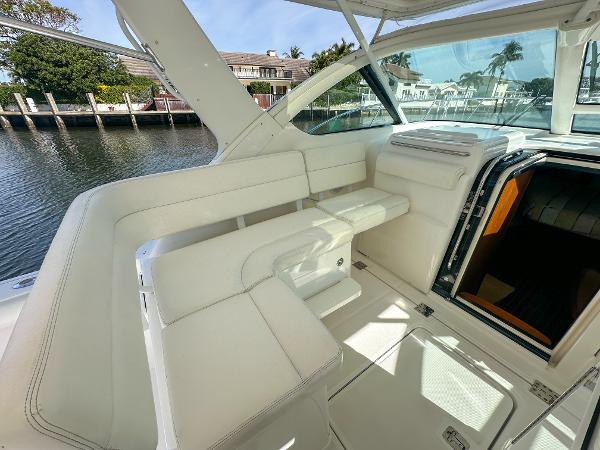 2006 Tiara Yachts 3200 Open interior with white seating and waterfront view.
