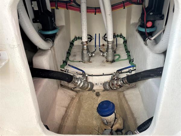 Bilge area of 2020 Front Runner 39 Center Console with hoses and fittings.