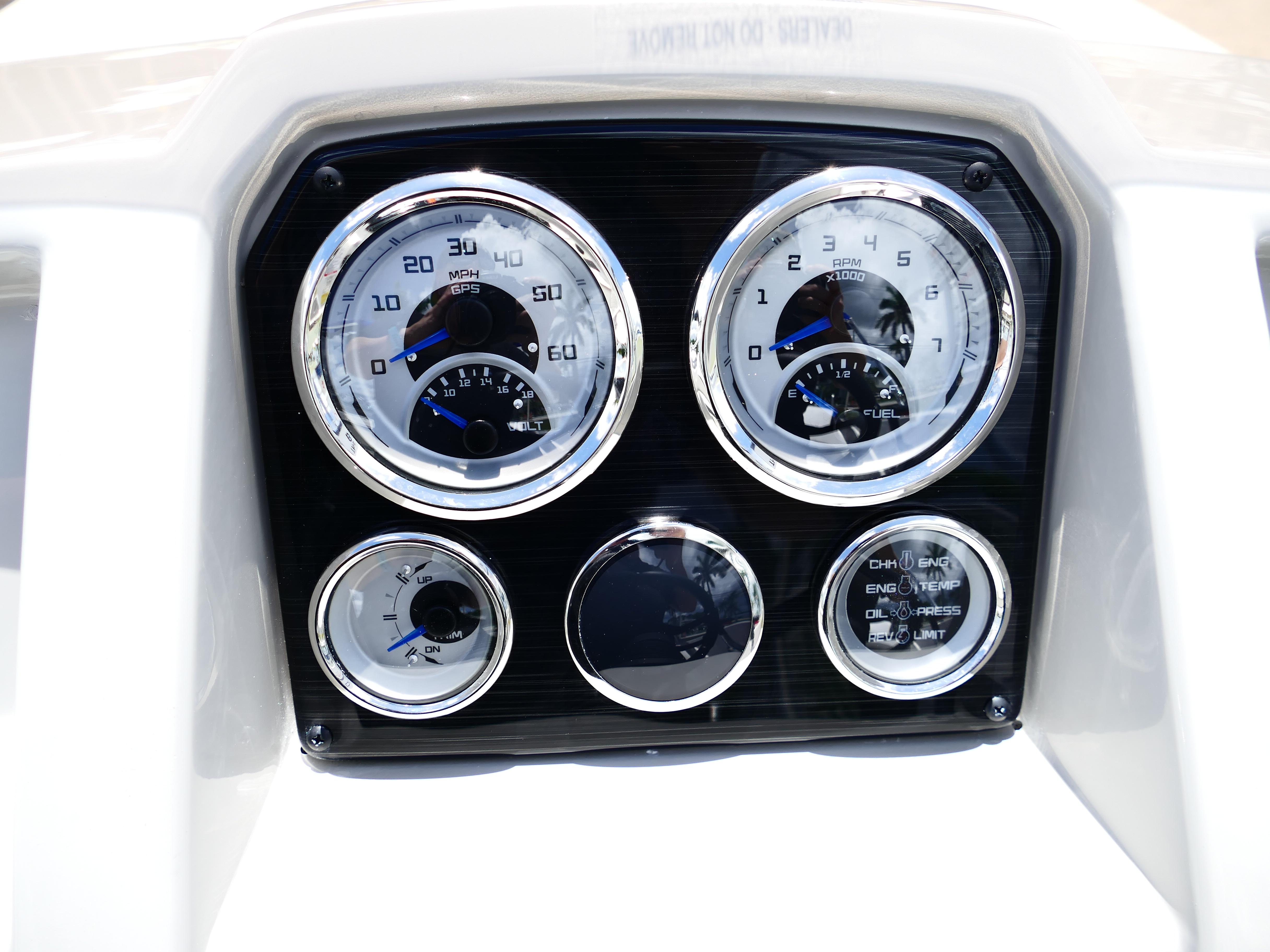 Dashboard of 2026 Starcraft SVX 231 OB DH boat with gauges and controls.
