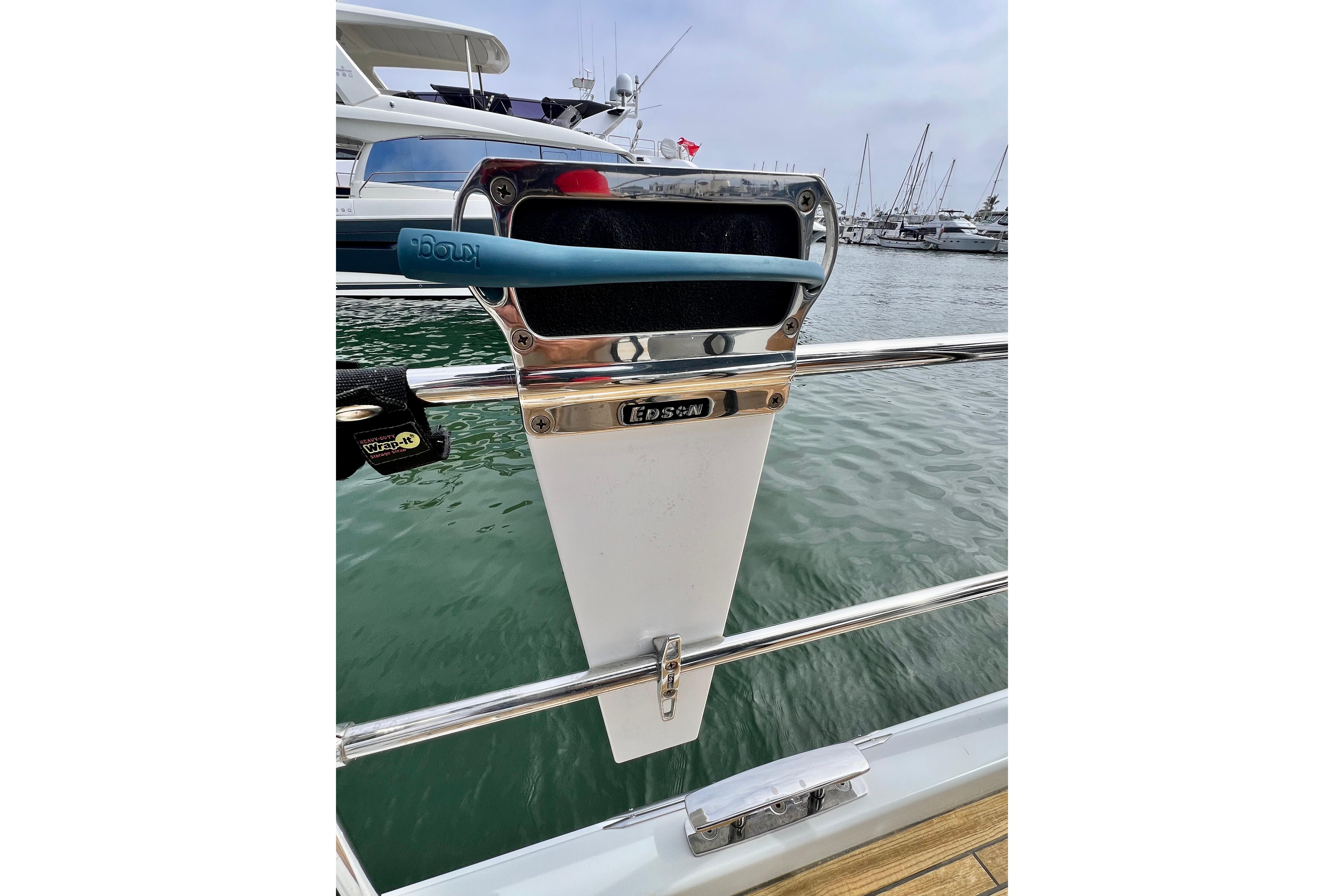 Sailboat steering pedestal on a 2016 Hanse 455, docked in a marina.
