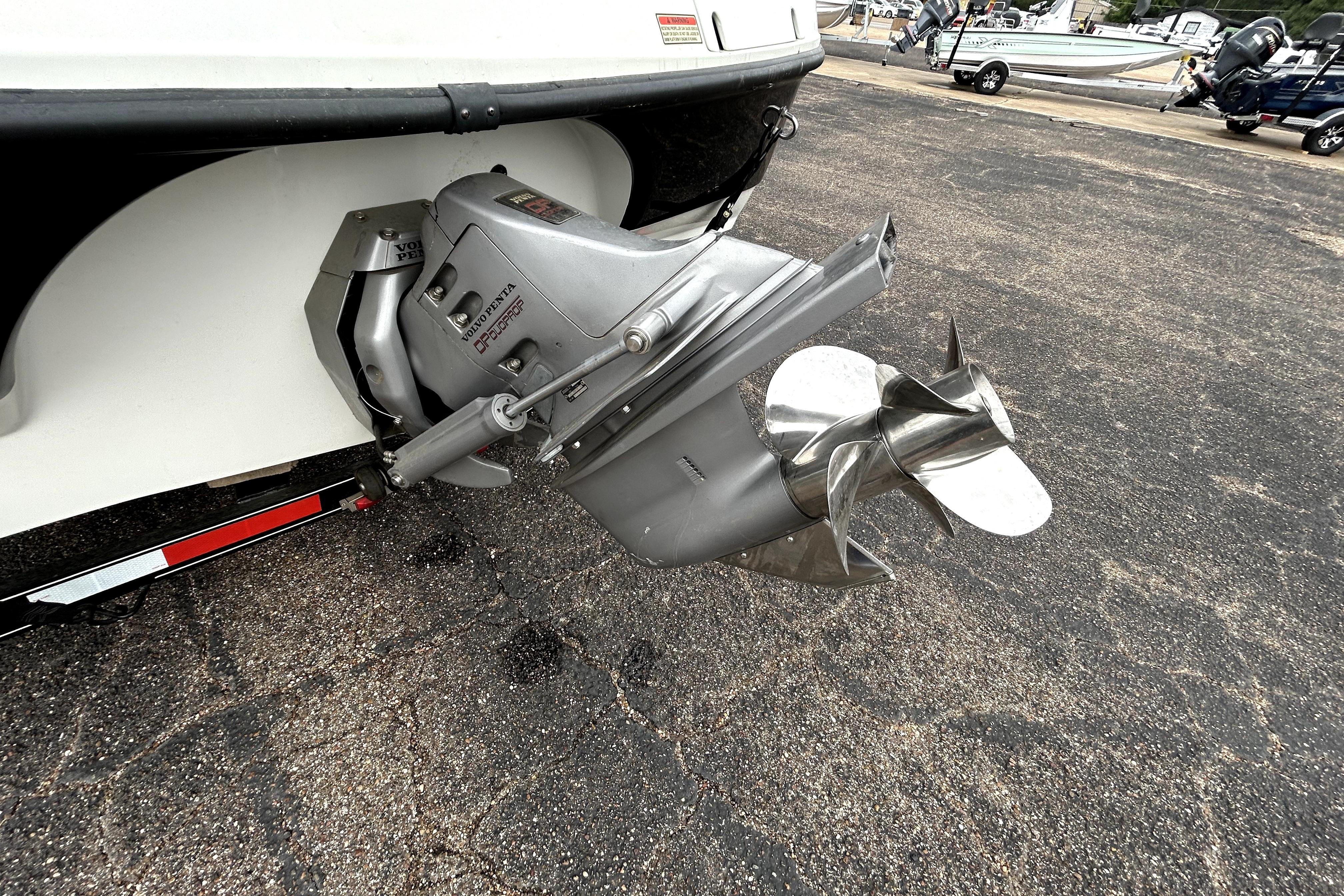 Outboard motor of a 2001 Crownline 239 DB boat on a trailer.