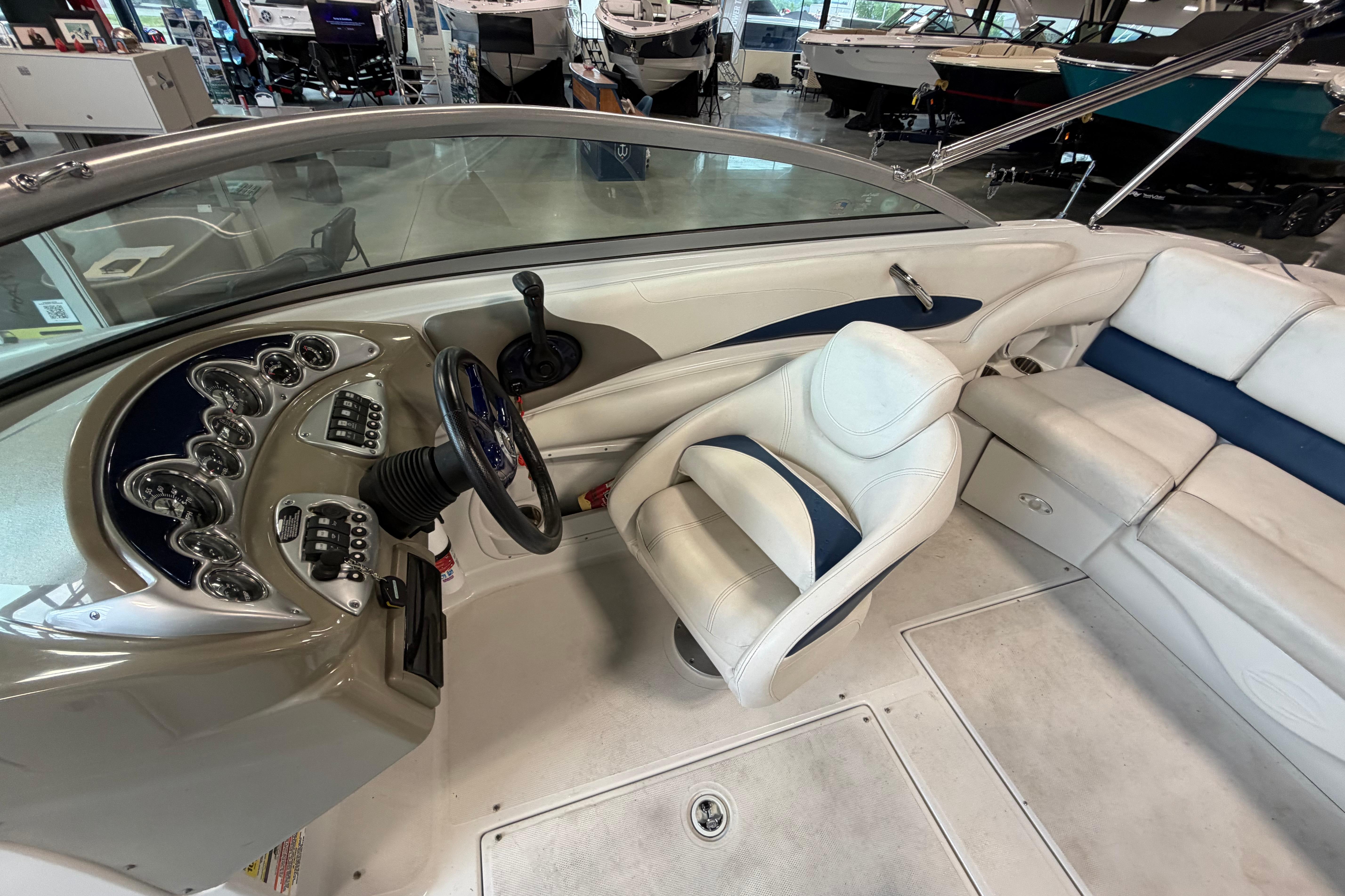 Interior view of a 2008 Crownline 220 LS boat, showcasing the helm and seating area.