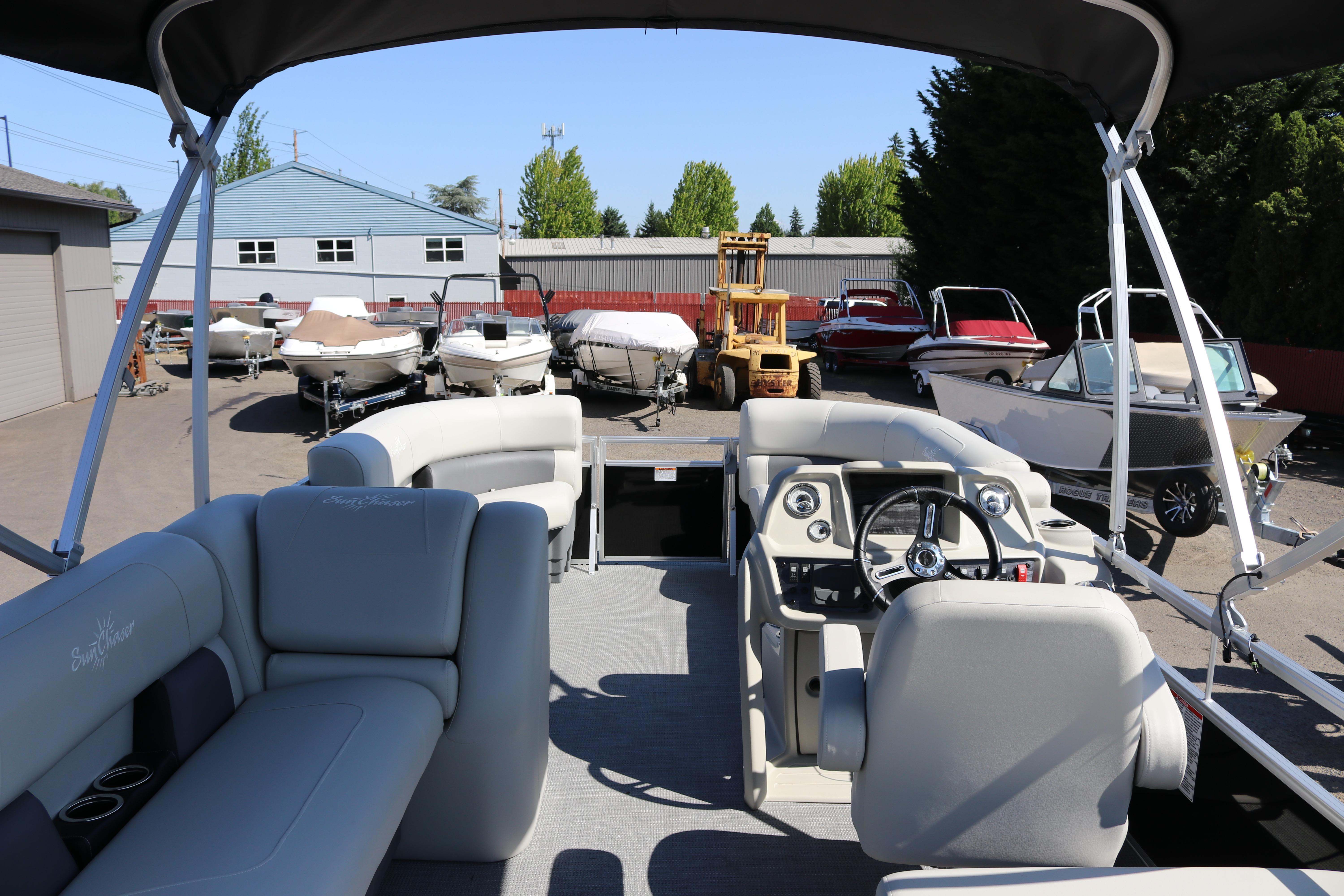 2025 SunChaser Vista 20 Fish pontoon boat interior with steering console and seating.