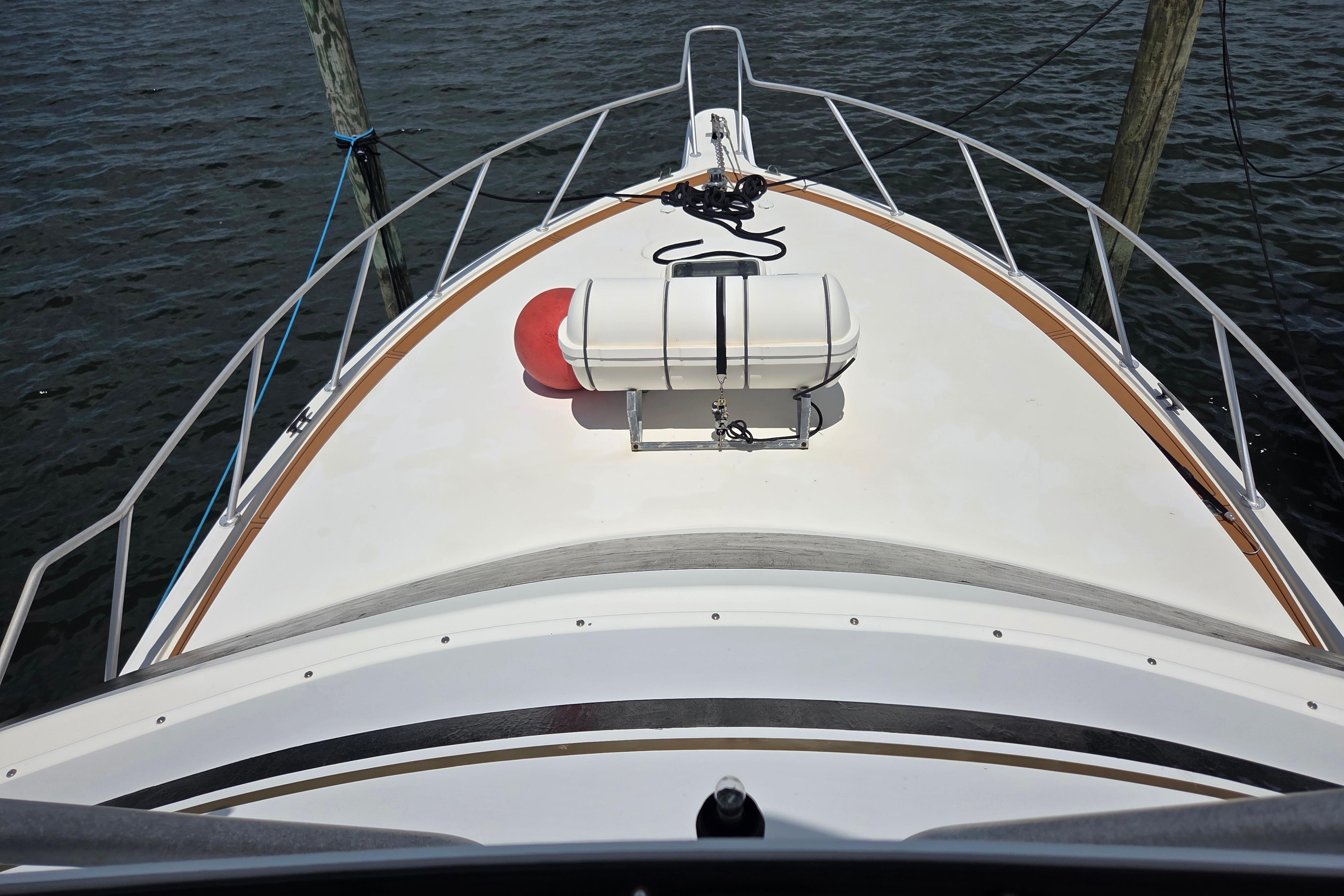 Bow view of 1990 Egg Harbor Golden Egg 42 yacht with life raft on deck.