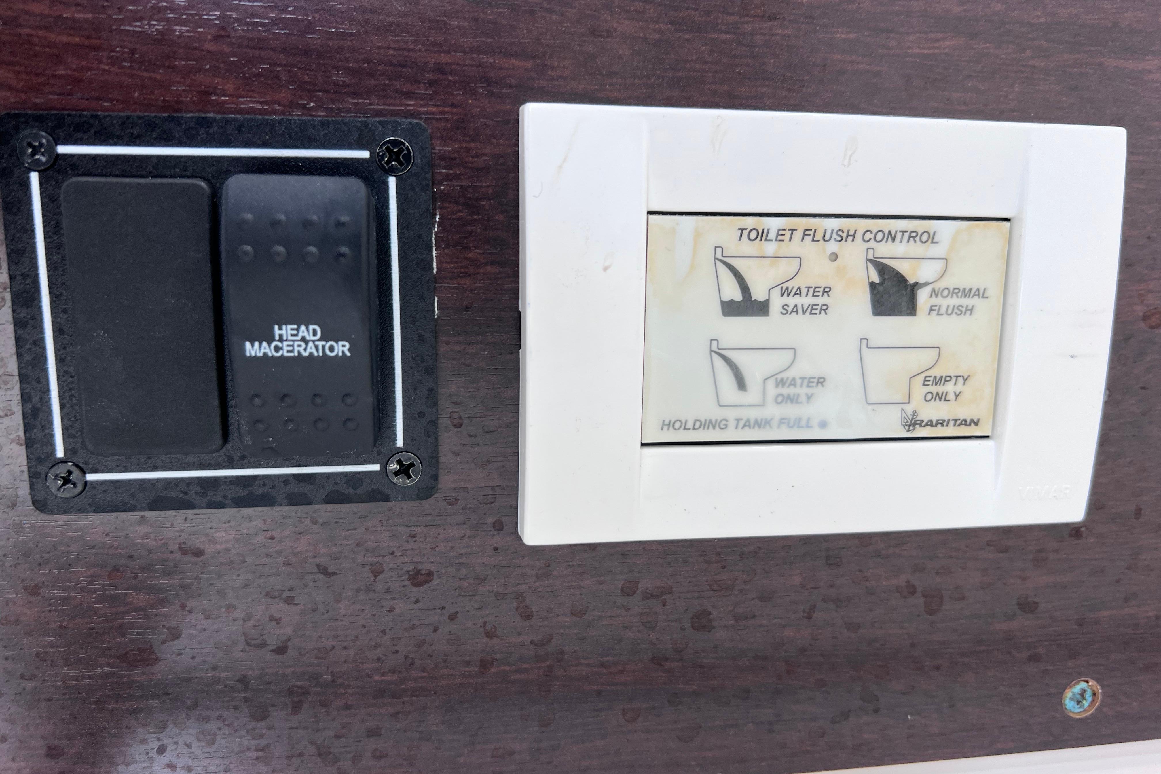 Control panel for toilet flush and head macerator on 2022 Pursuit S 288 Sport.
