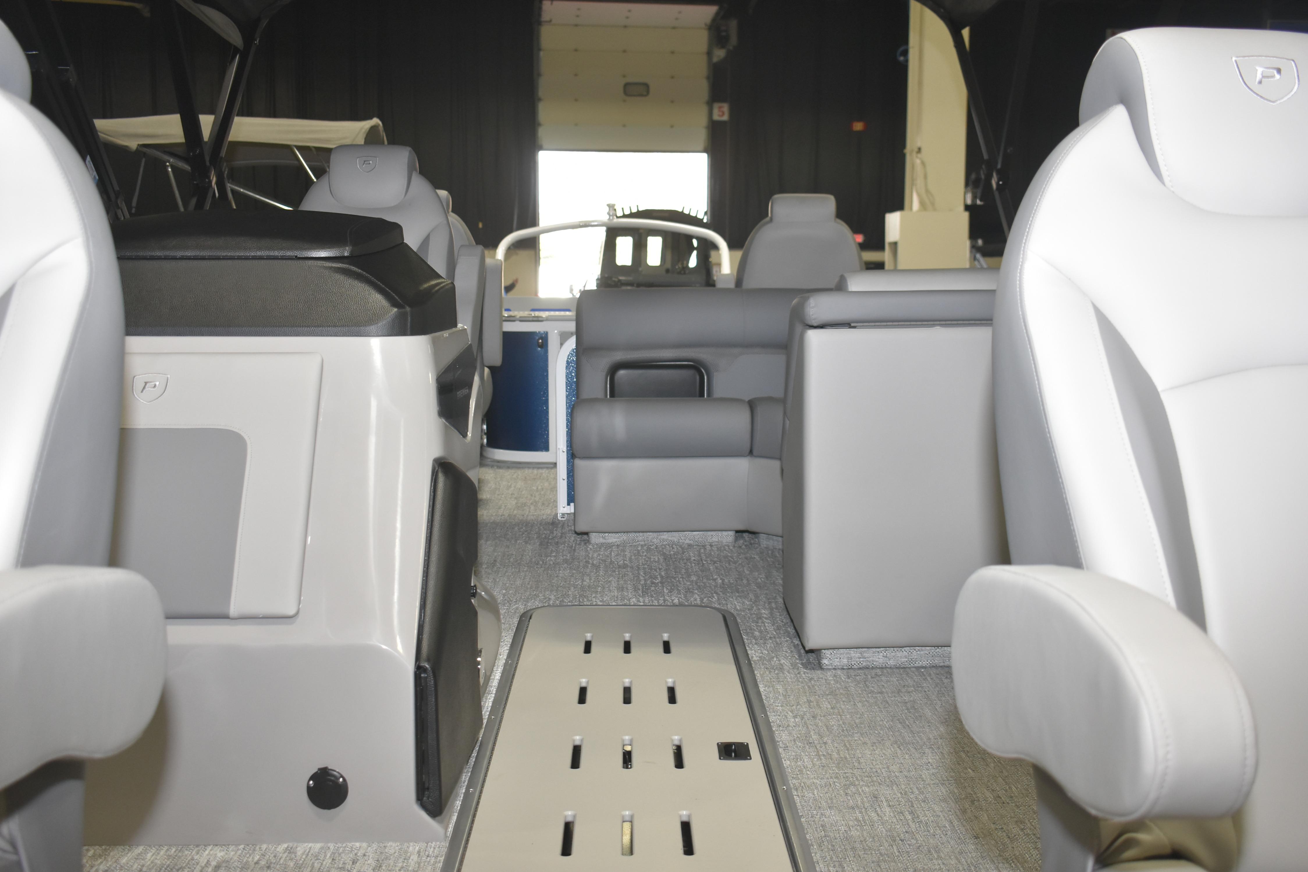 Interior of 2026 Premier 230 Sunsation Angler 4PT boat, featuring modern seating and design.