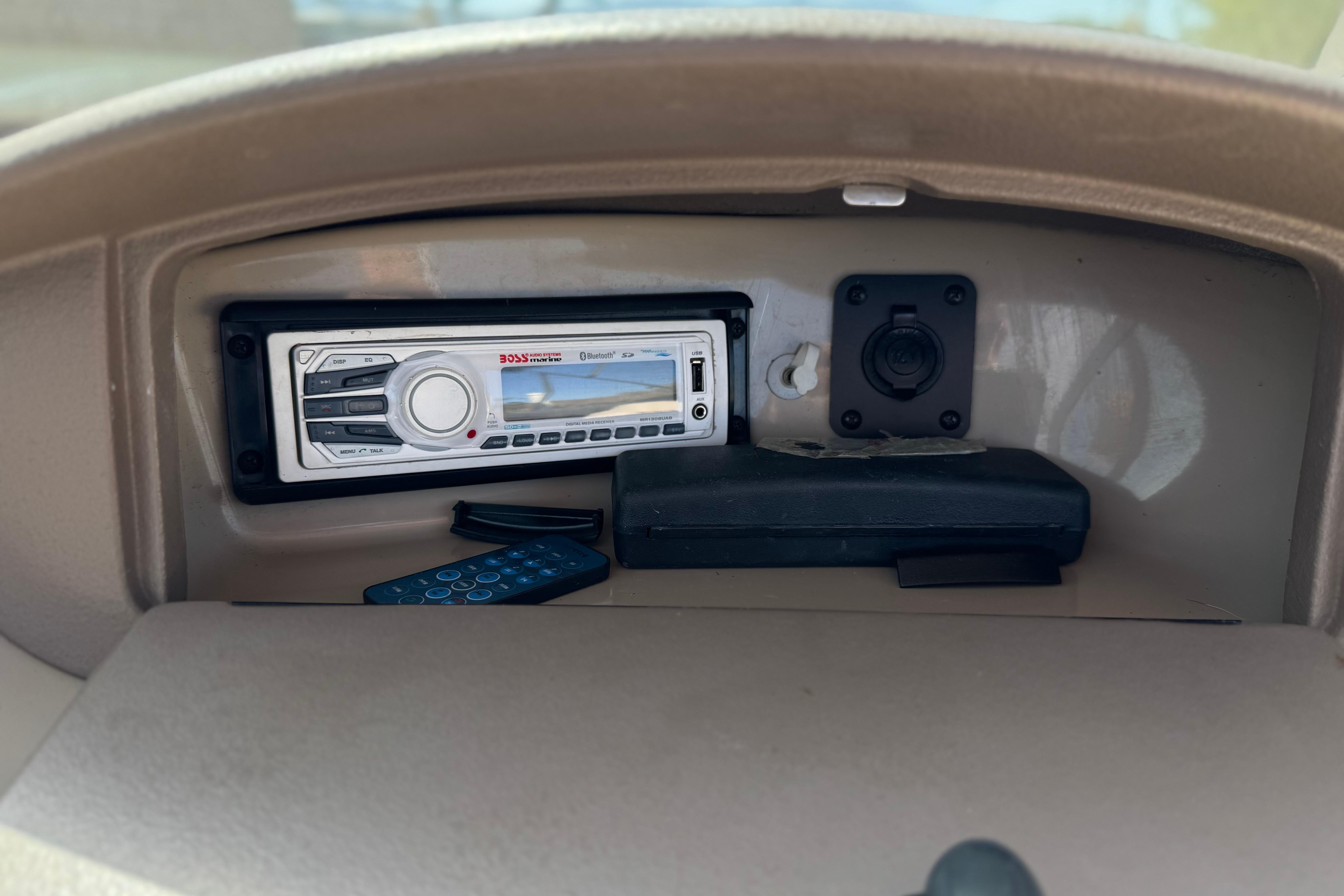 Dashboard of 2006 Chaparral 190 SSi with Boss audio system and remote control.