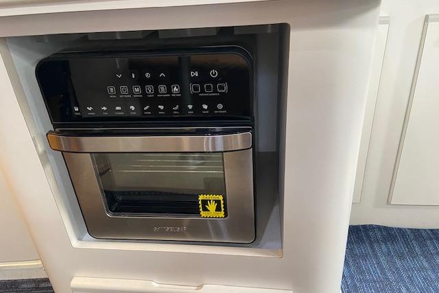 Built-in microwave oven in 1994 Cruisers Yachts 3675 Esprit kitchen area.
