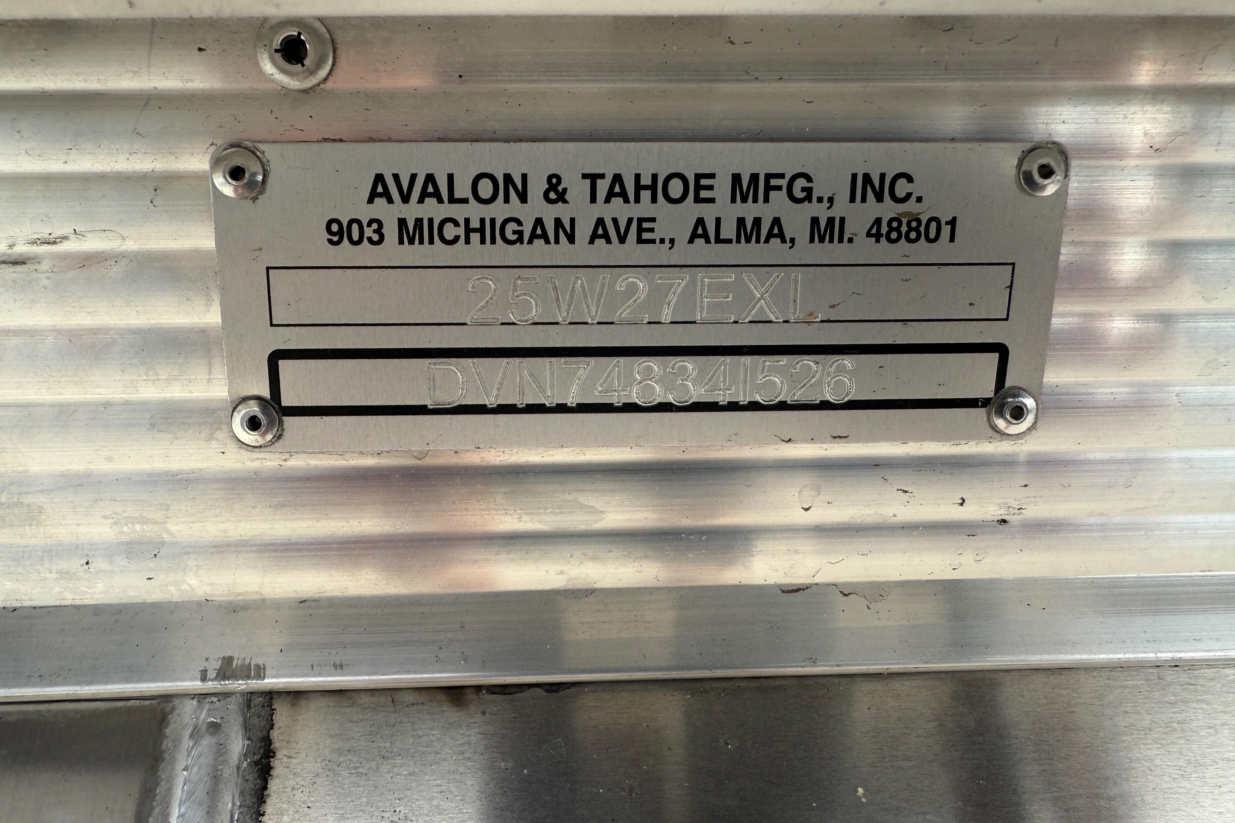 Metal identification plate for Avalon & Tahoe MFG, Inc., featuring model and serial numbers.
