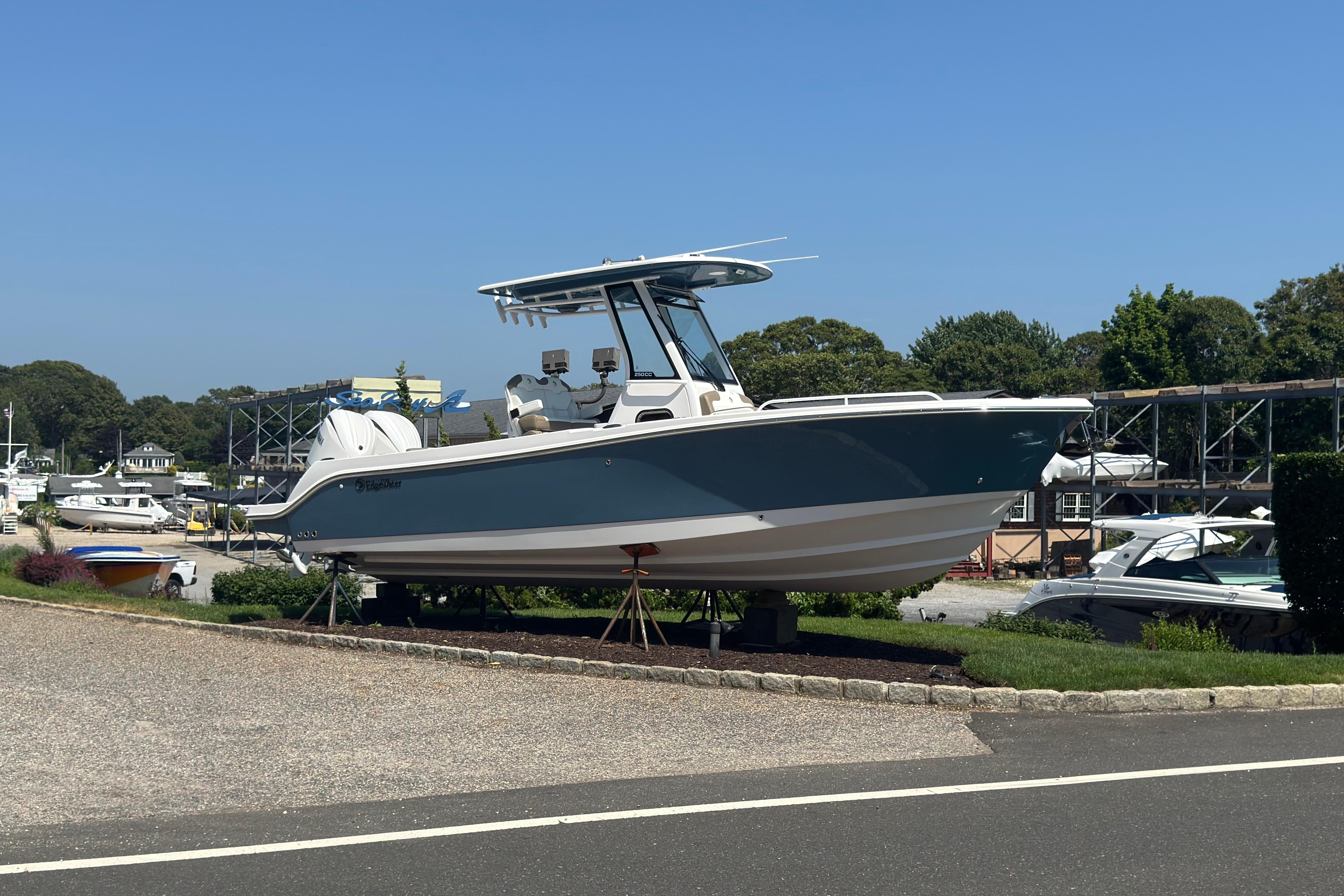 2026 Edgewater 250CC boat displayed outdoors on a sunny day.