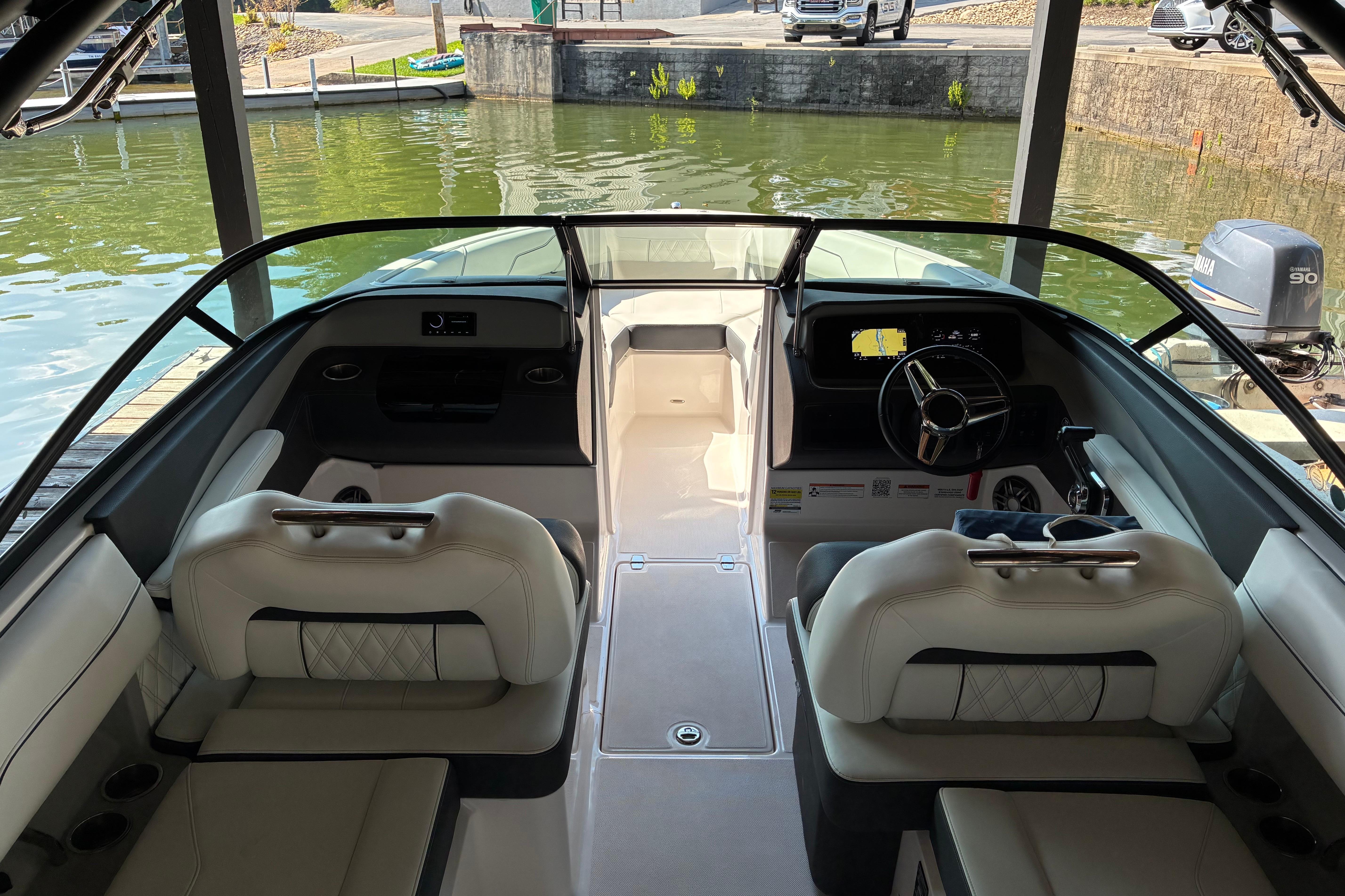 Interior view of 2025 Regal LS2 boat, featuring modern seating and dashboard.