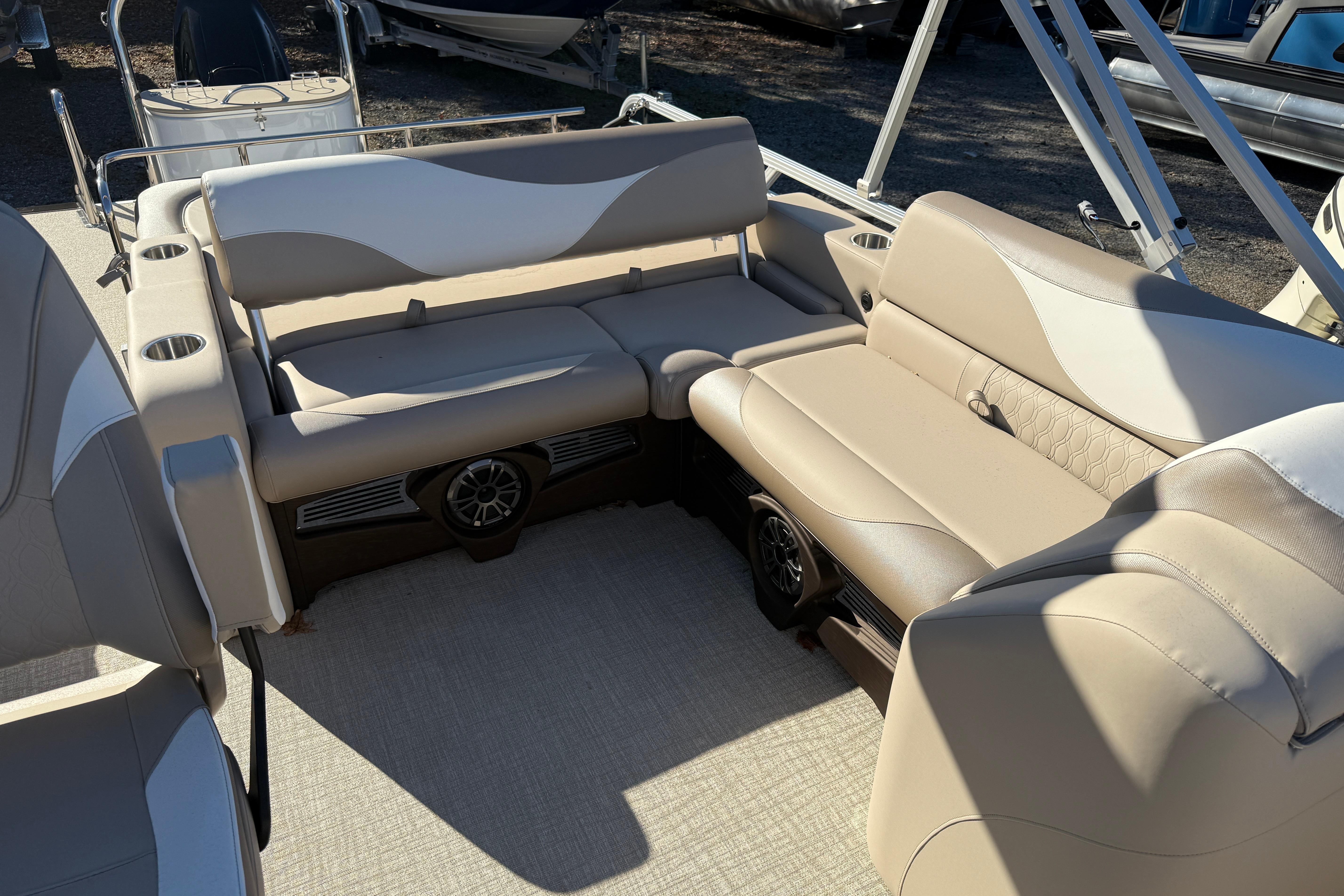 2026 Tahoe Pontoon LTZ Versatile Rear Lounger with beige seating and cup holders.