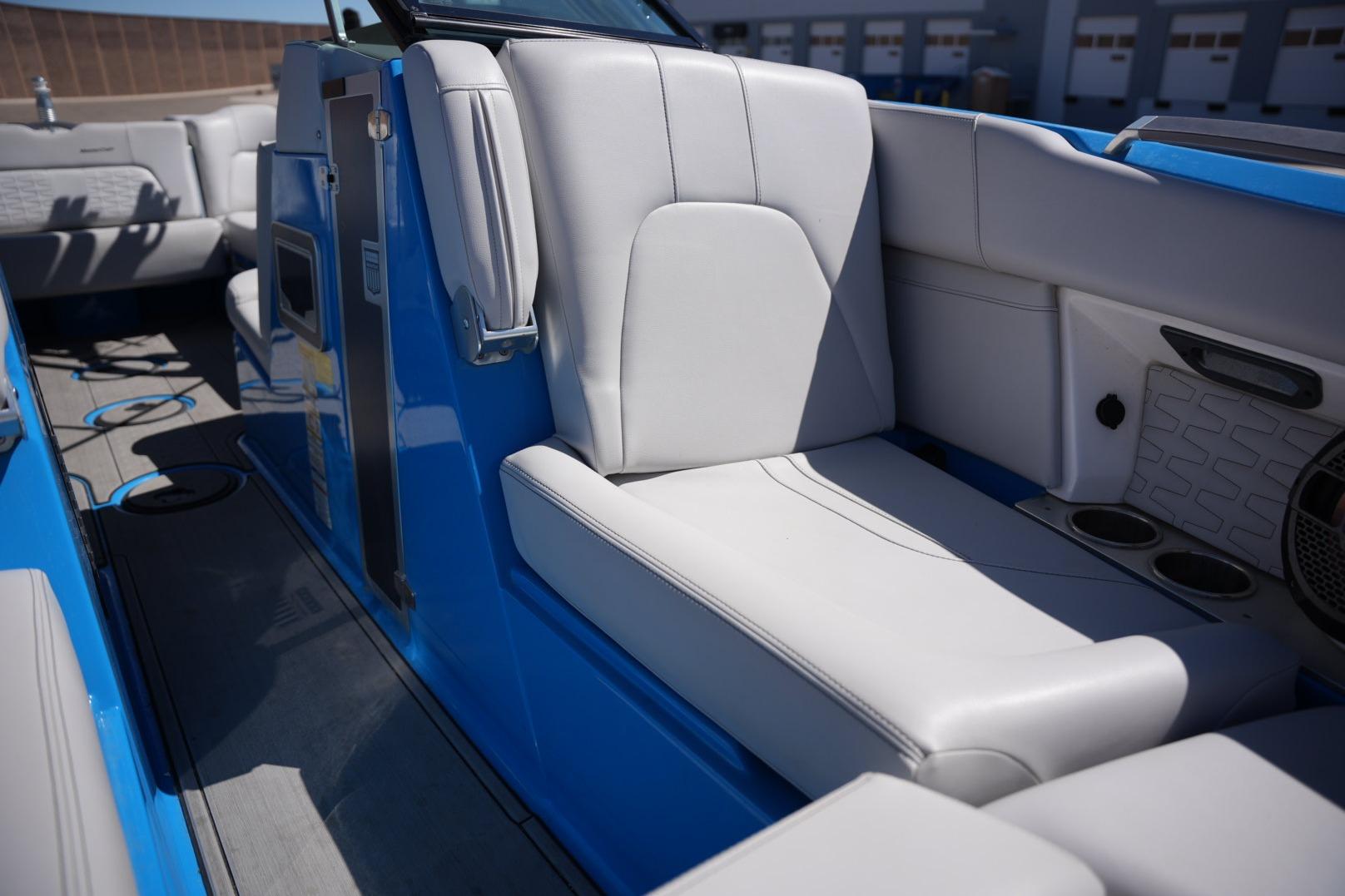 2020 MasterCraft X22 boat interior with white seating and blue accents.