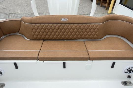 Luxurious tan seating on 2026 Sea Hunt Ultra 255 SE boat, featuring diamond-patterned upholstery.