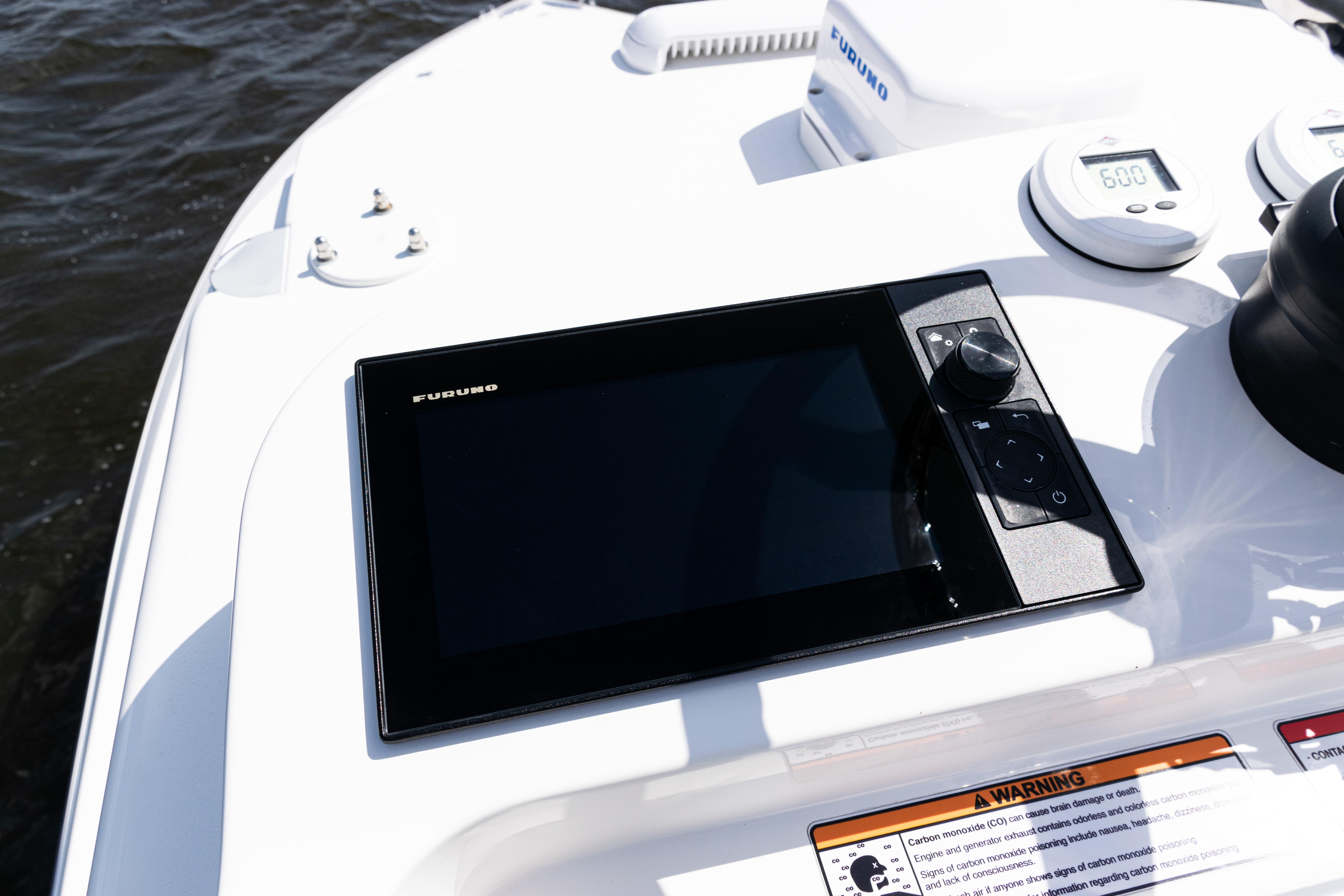 2024 SeaVee 290B boat dashboard with Furuno navigation display.