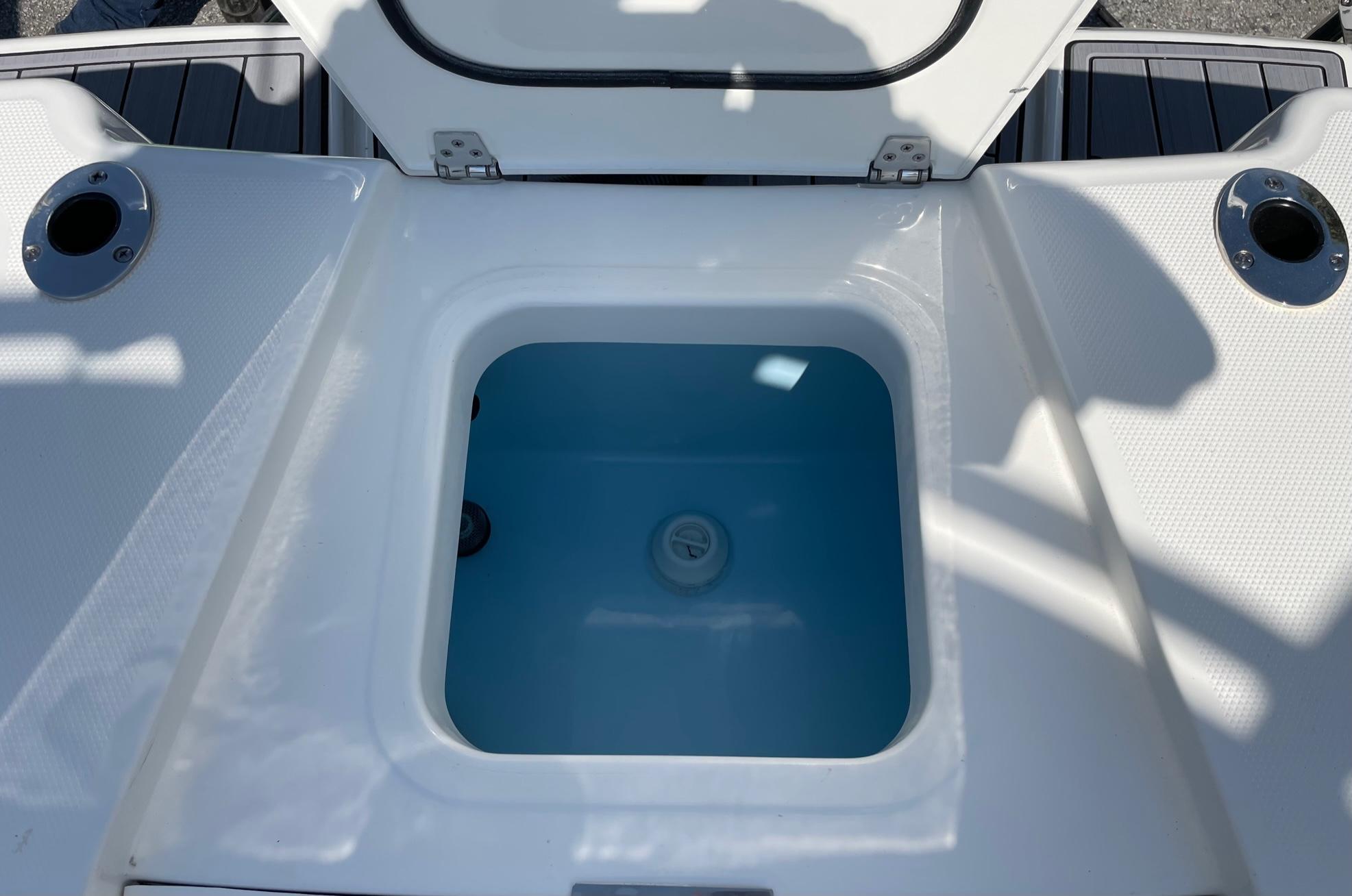 2024 Pathfinder 2400 Open boat livewell with open lid, showcasing interior.