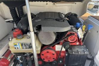 Engine compartment of a 2019 Bryant Calandra 23 boat, showcasing detailed components.