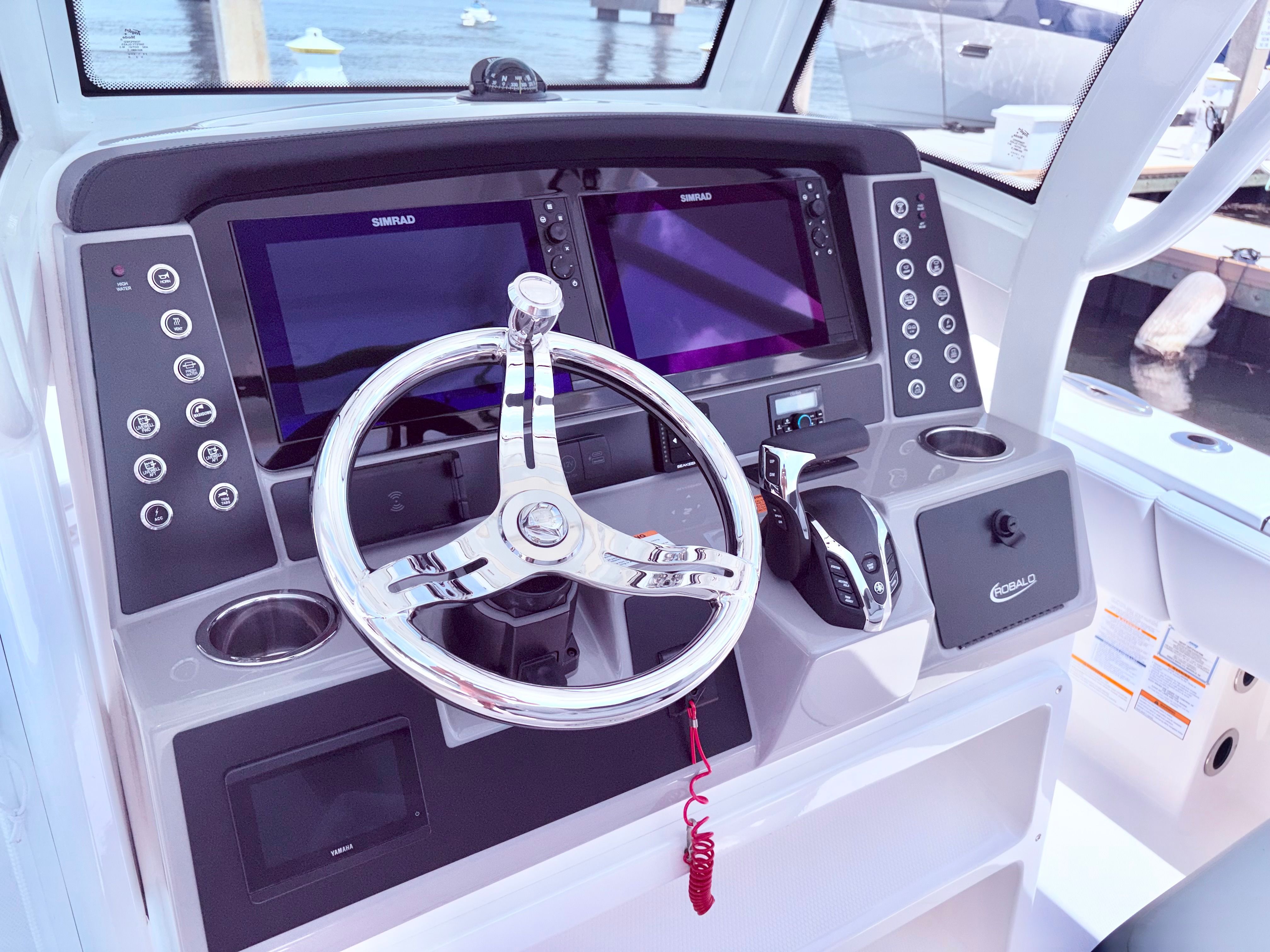 2025 Robalo 266 Cayman helm with modern controls and displays.
