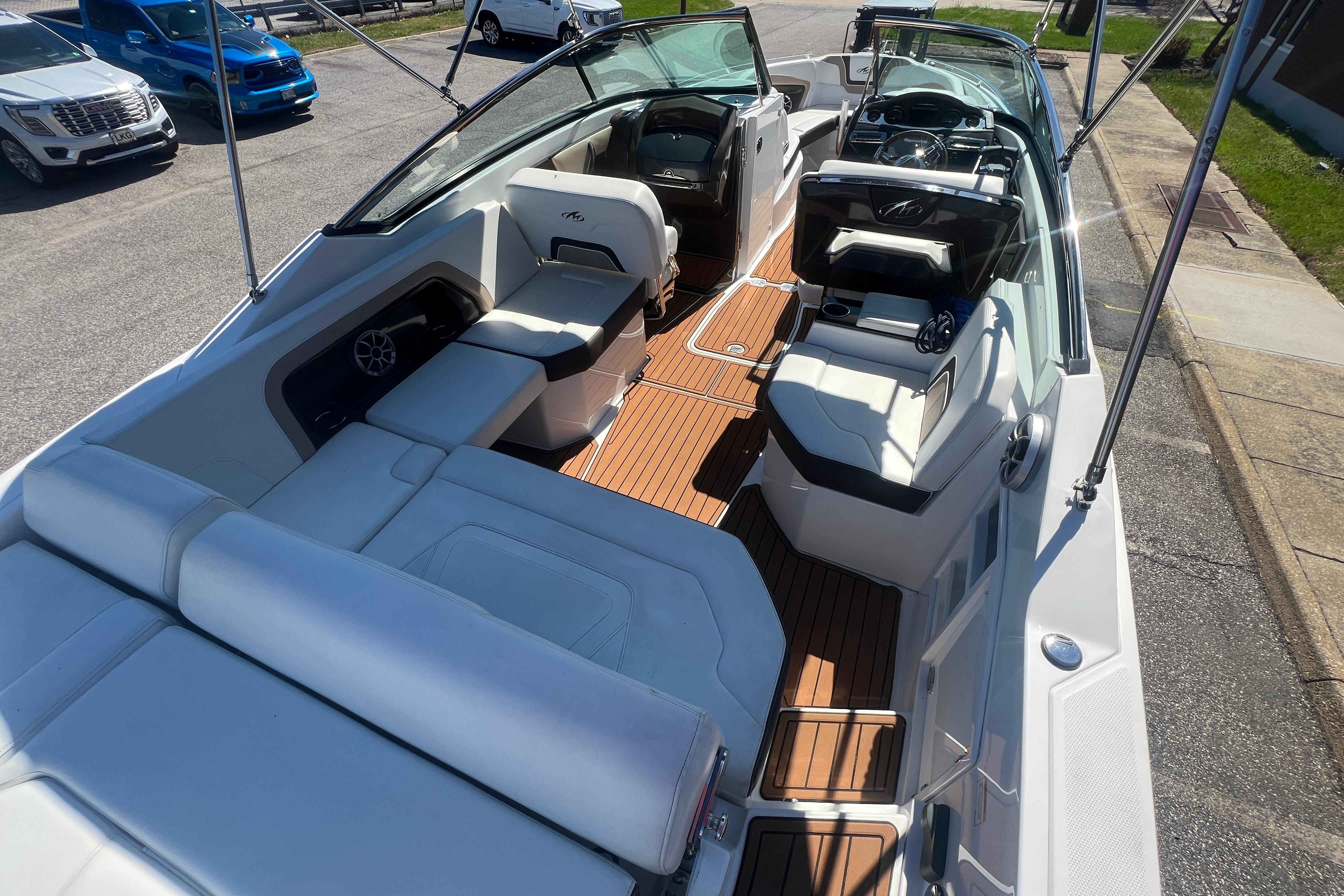 2017 Monterey 298SS Super Sport boat interior with white seating and wood flooring.