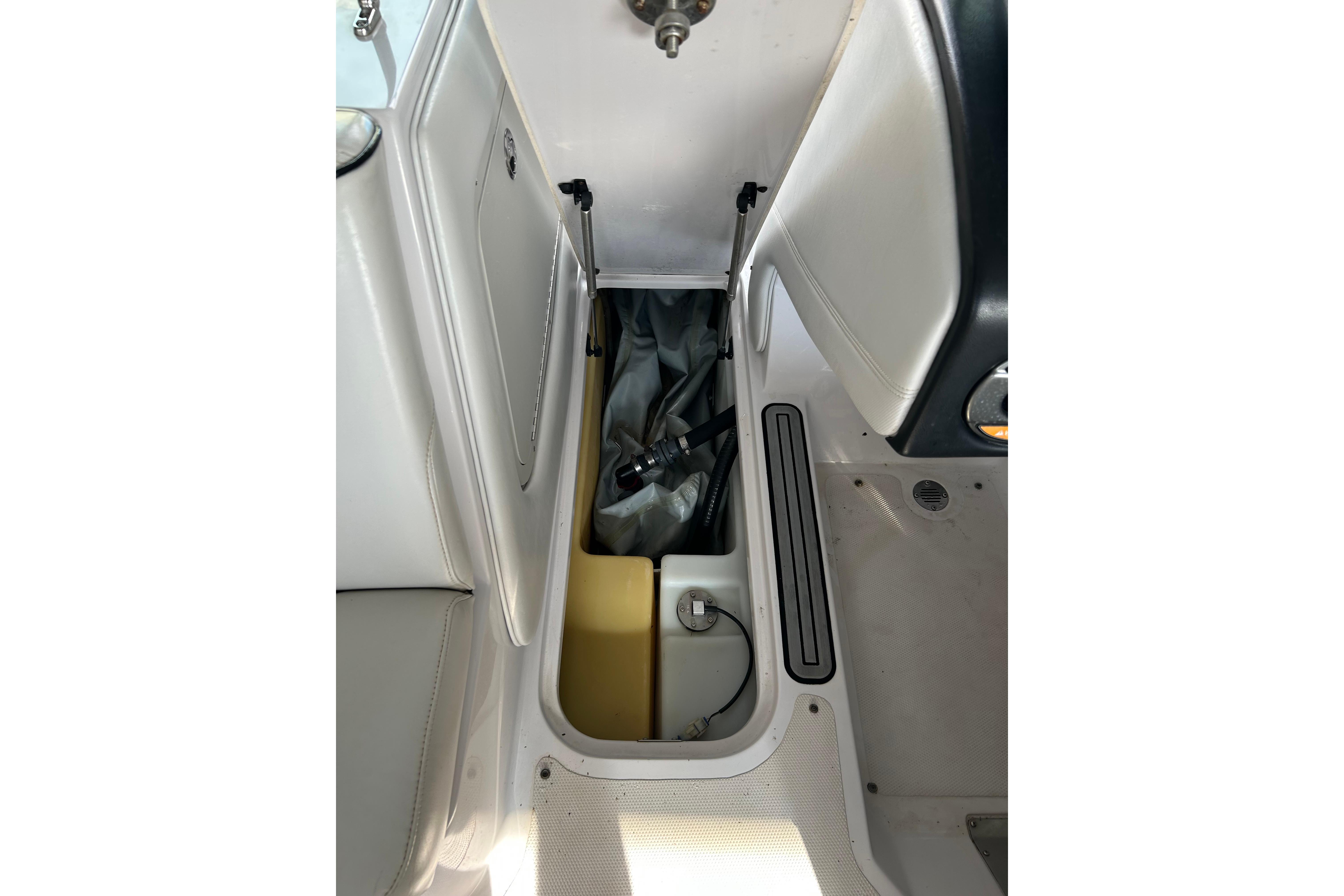 2010 Nautique Super Air Nautique 210 Coastal Edition interior storage compartment.