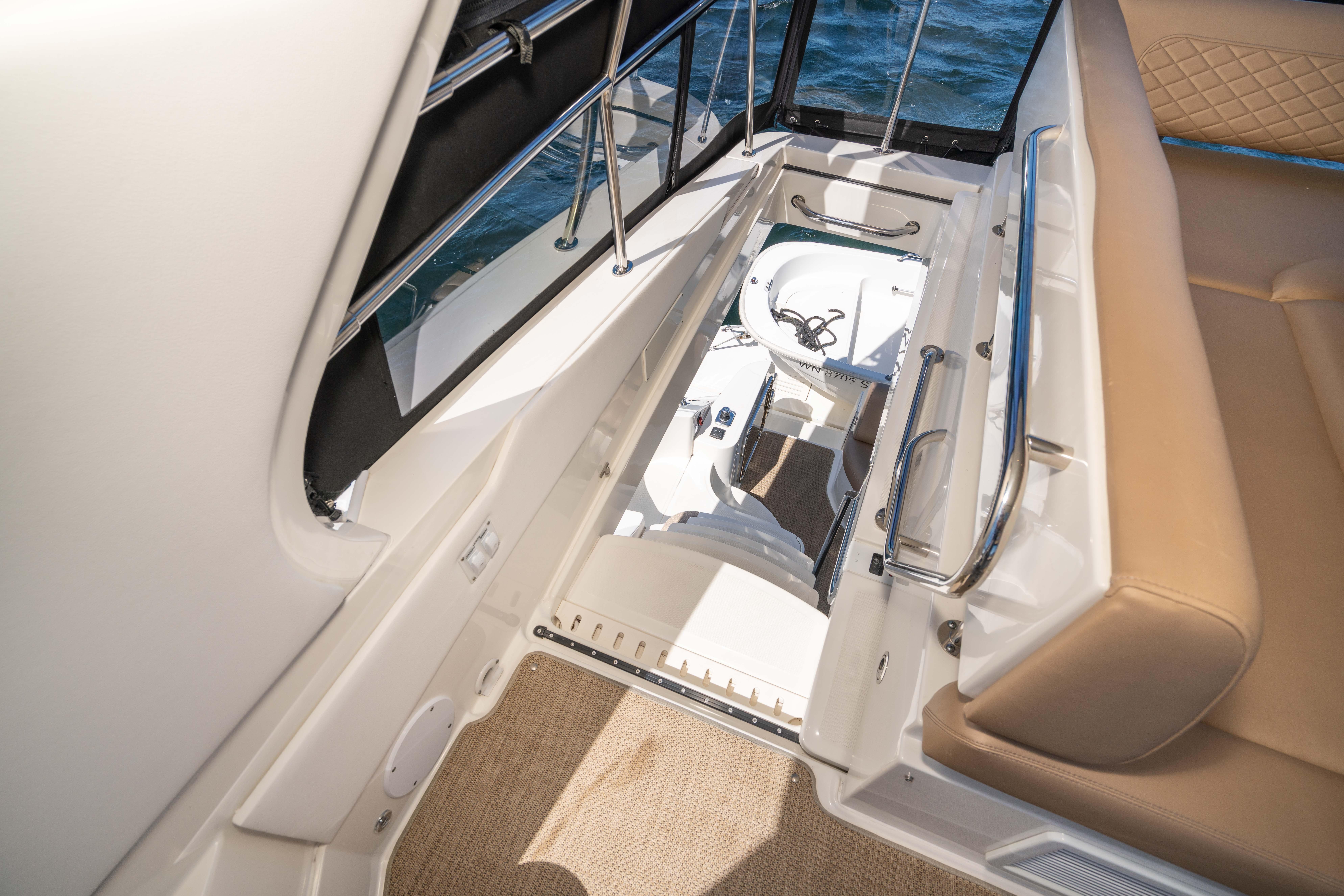 2017 Sea Ray 510 Fly yacht interior with seating and storage compartment.