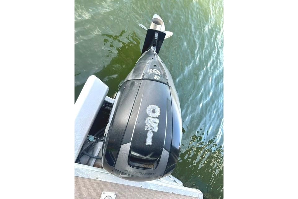 Outboard motor on 2019 Sun Tracker Party Barge 22 XP3, floating on water.