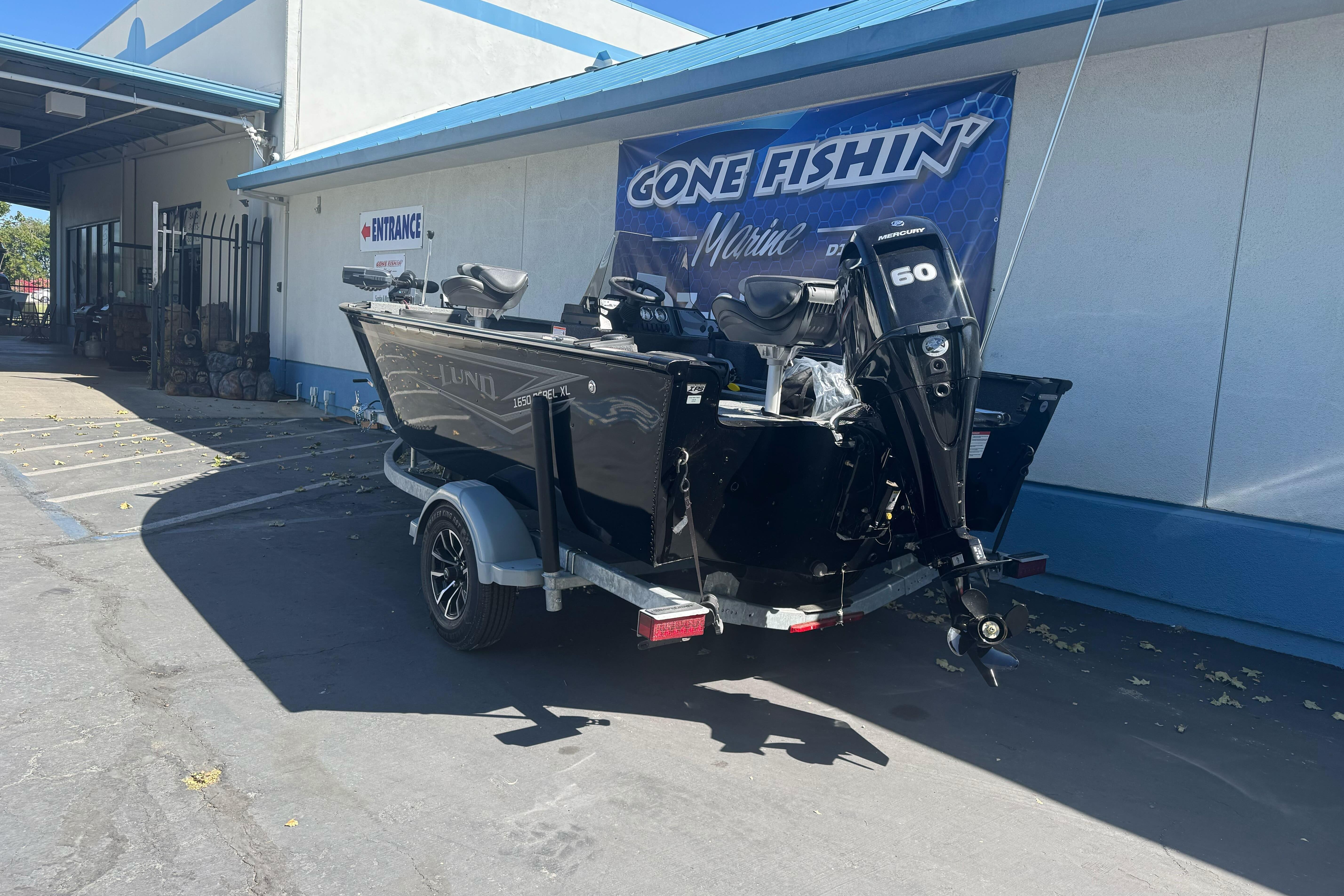2026 Lund 1650 Rebel XL SS boat with Mercury 60 engine at dealership.