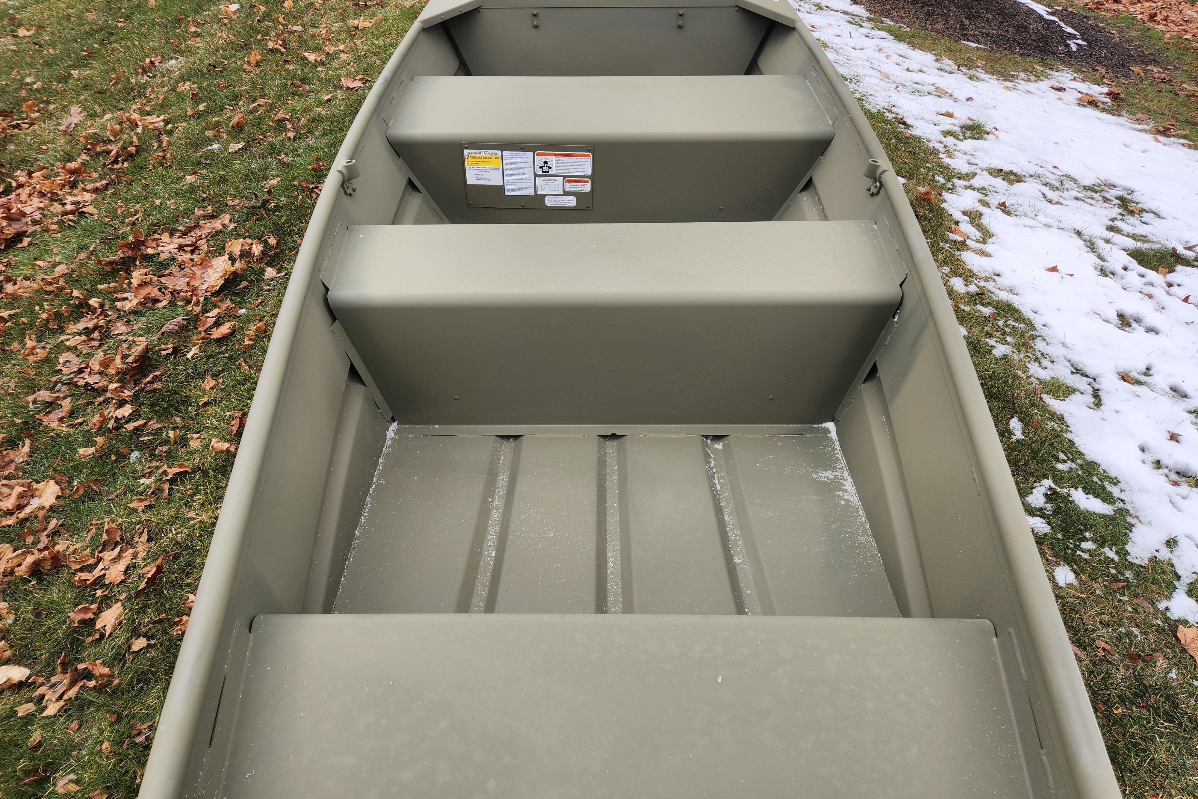 2026 Tracker Grizzly 10 Jon boat on grass with autumn leaves and snow.