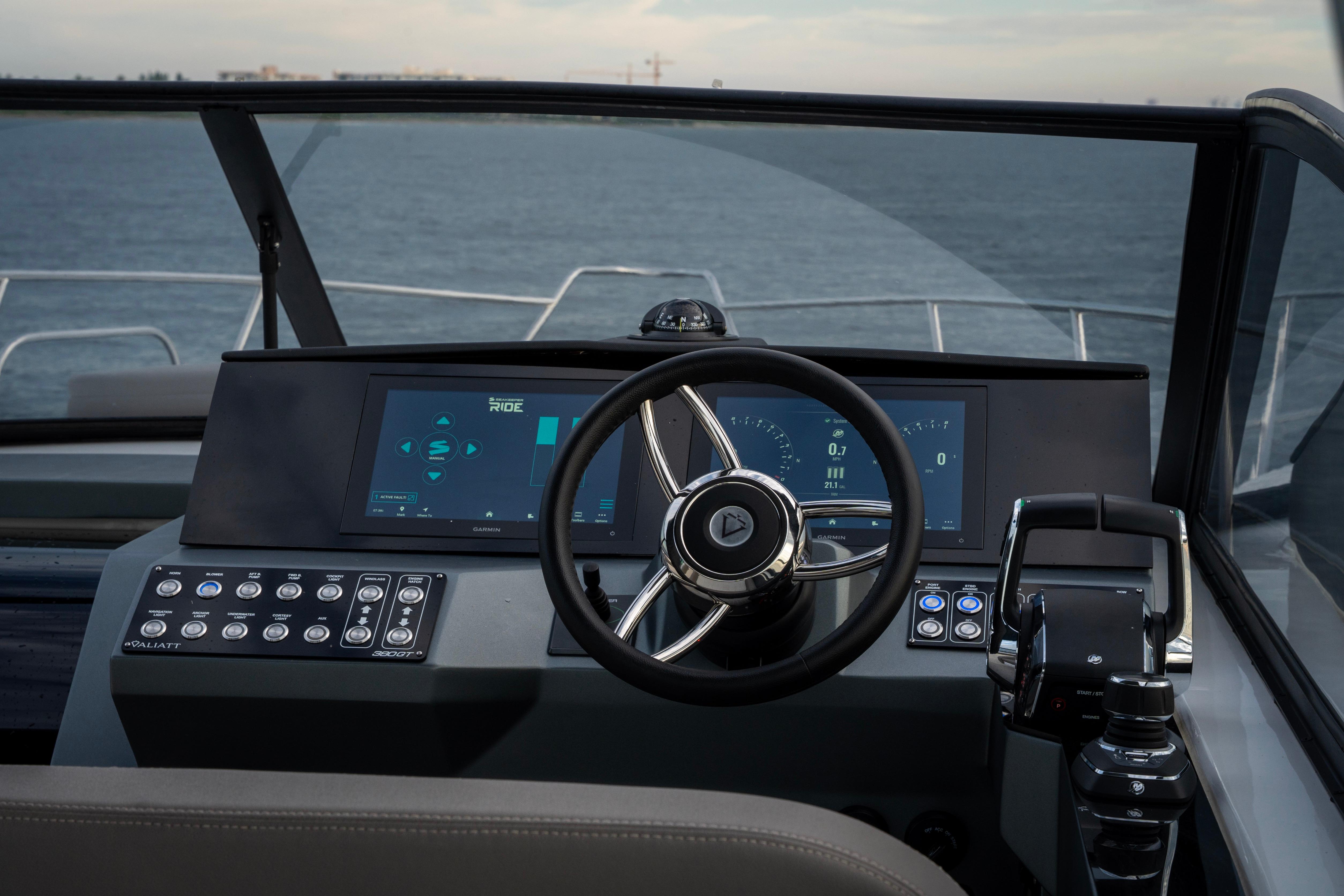 Helm of 2025 Valiatt 380GT boat with modern controls and digital displays.