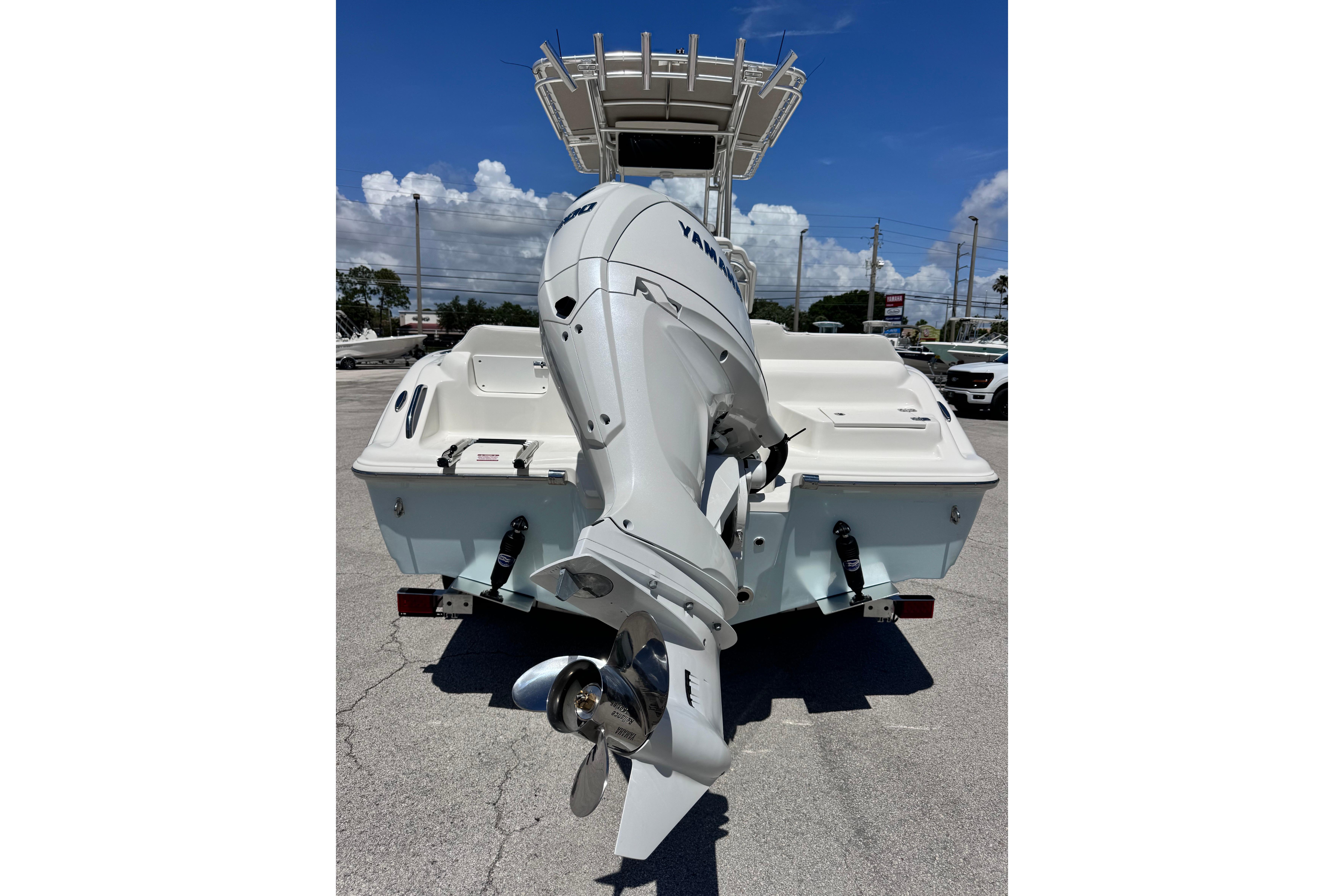 2026 Key West 219 FS boat with Yamaha outboard motor, parked on pavement.