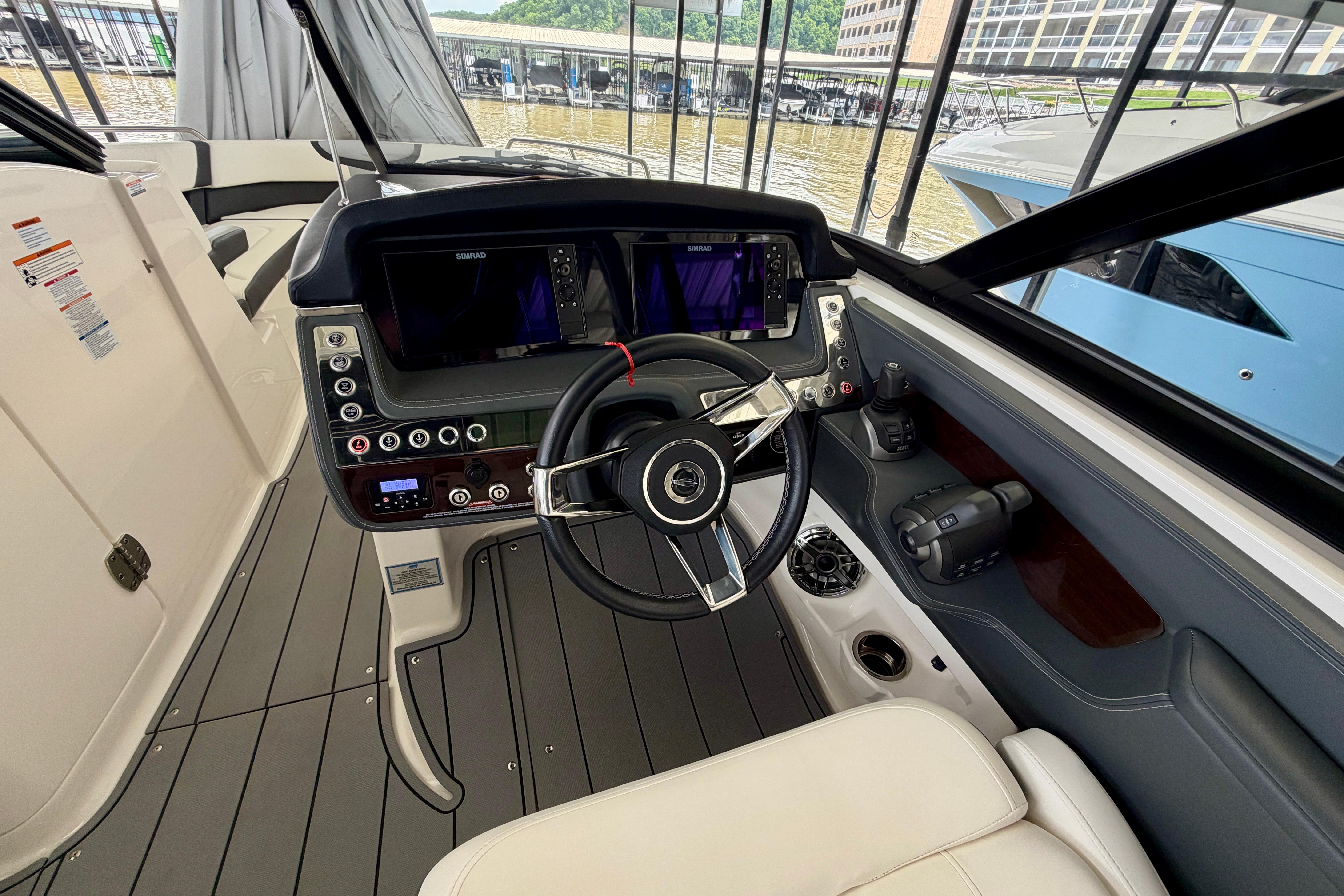 2022 Chaparral 317 SSX boat cockpit with modern steering and navigation displays.