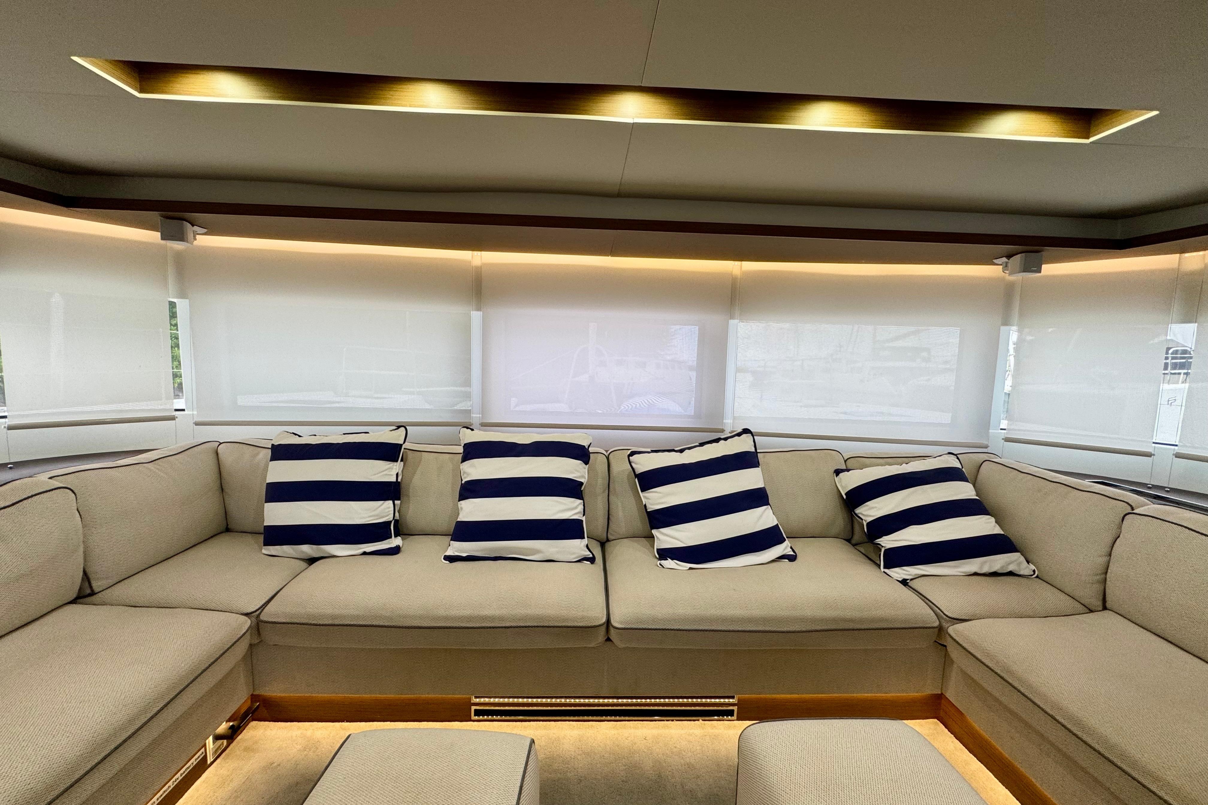 Luxurious interior of 2020 Lagoon 50 yacht with striped cushions and elegant lighting.
