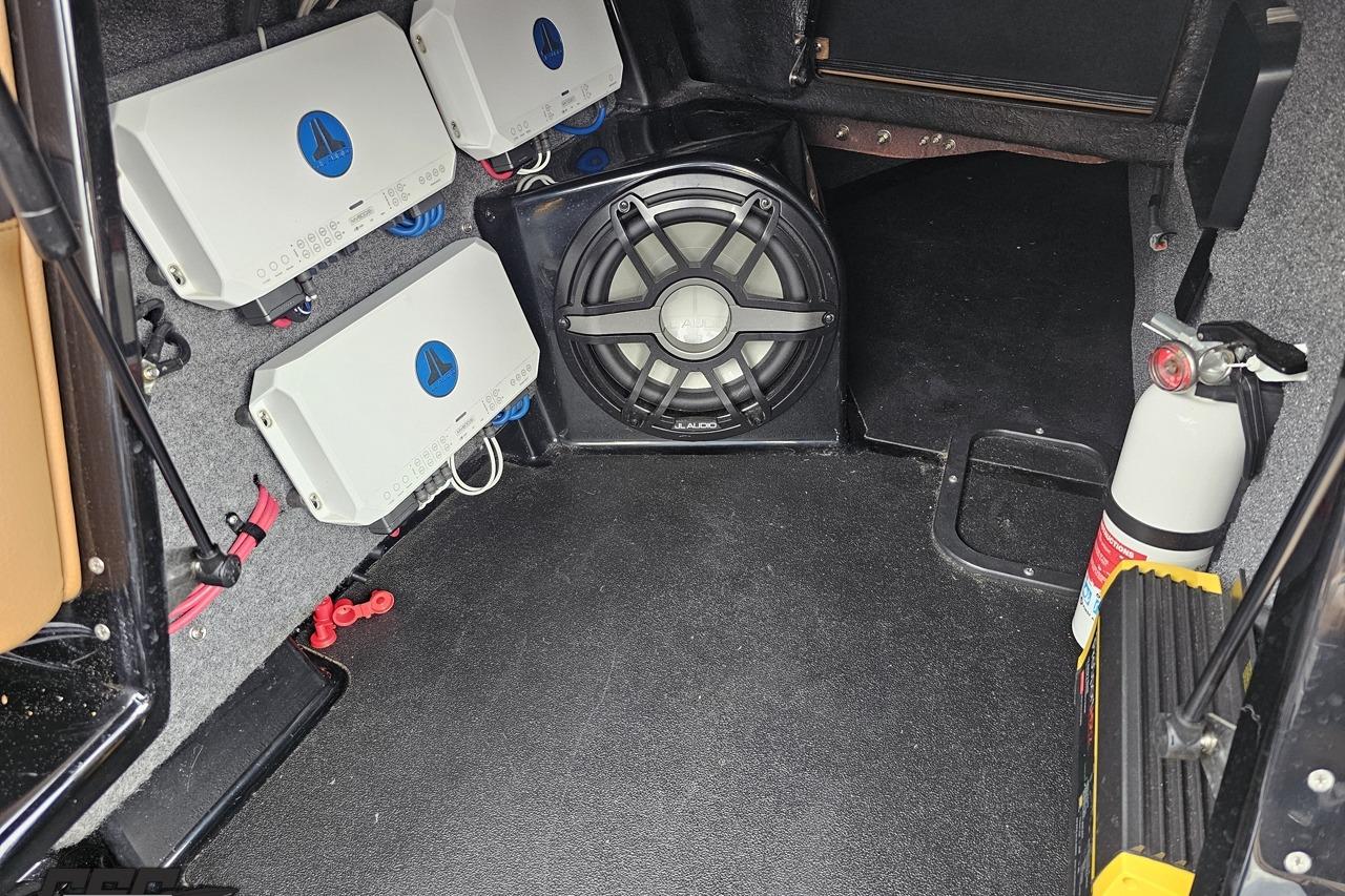 Audio system setup in a 2022 Supra SE 550 with amplifiers and subwoofer.