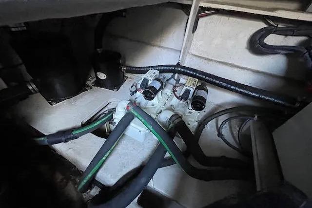 Engine compartment of 2016 Sea Ray Sundancer 510 with visible hoses and components.