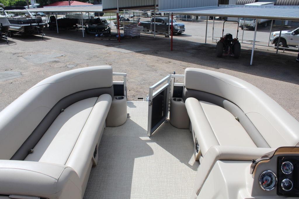 2021 Avalon VLS Quad Lounge 22 FT interior with beige seating and open gate.