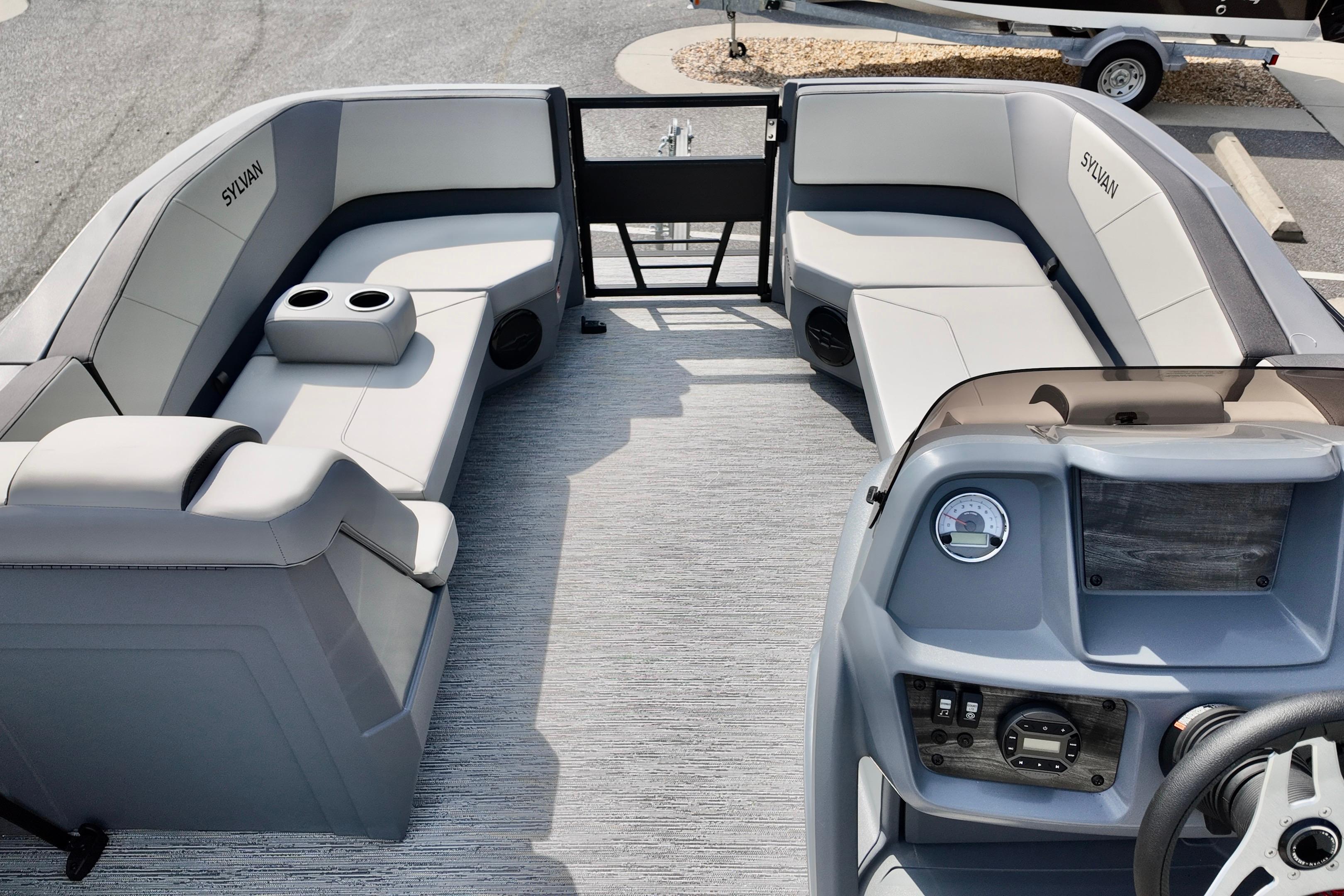 2026 Sylvan A-20 LZ DH pontoon boat interior with plush seating and modern dashboard.
