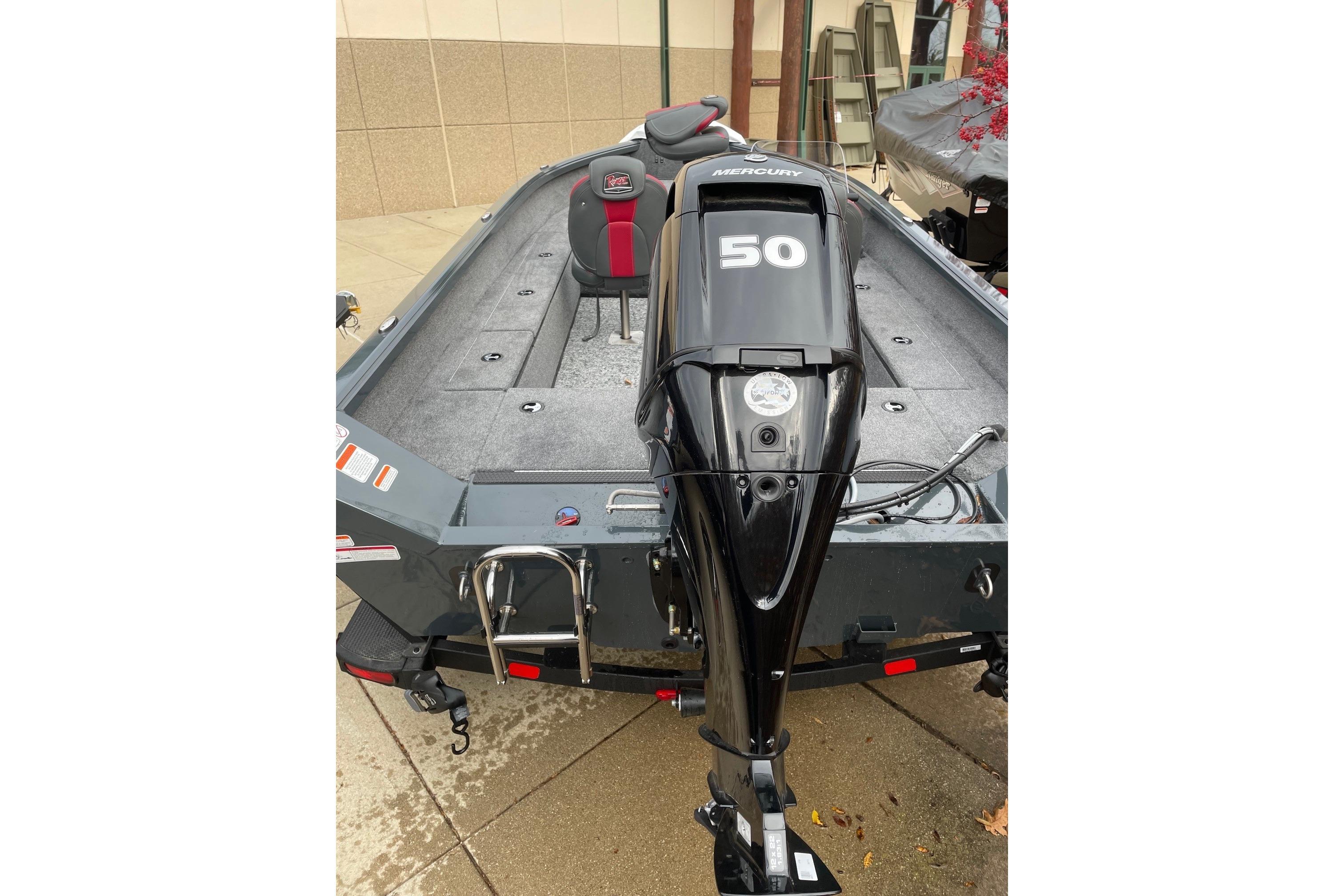 2026 Ranger VS1665SC boat with Mercury 50 outboard motor, parked on concrete.