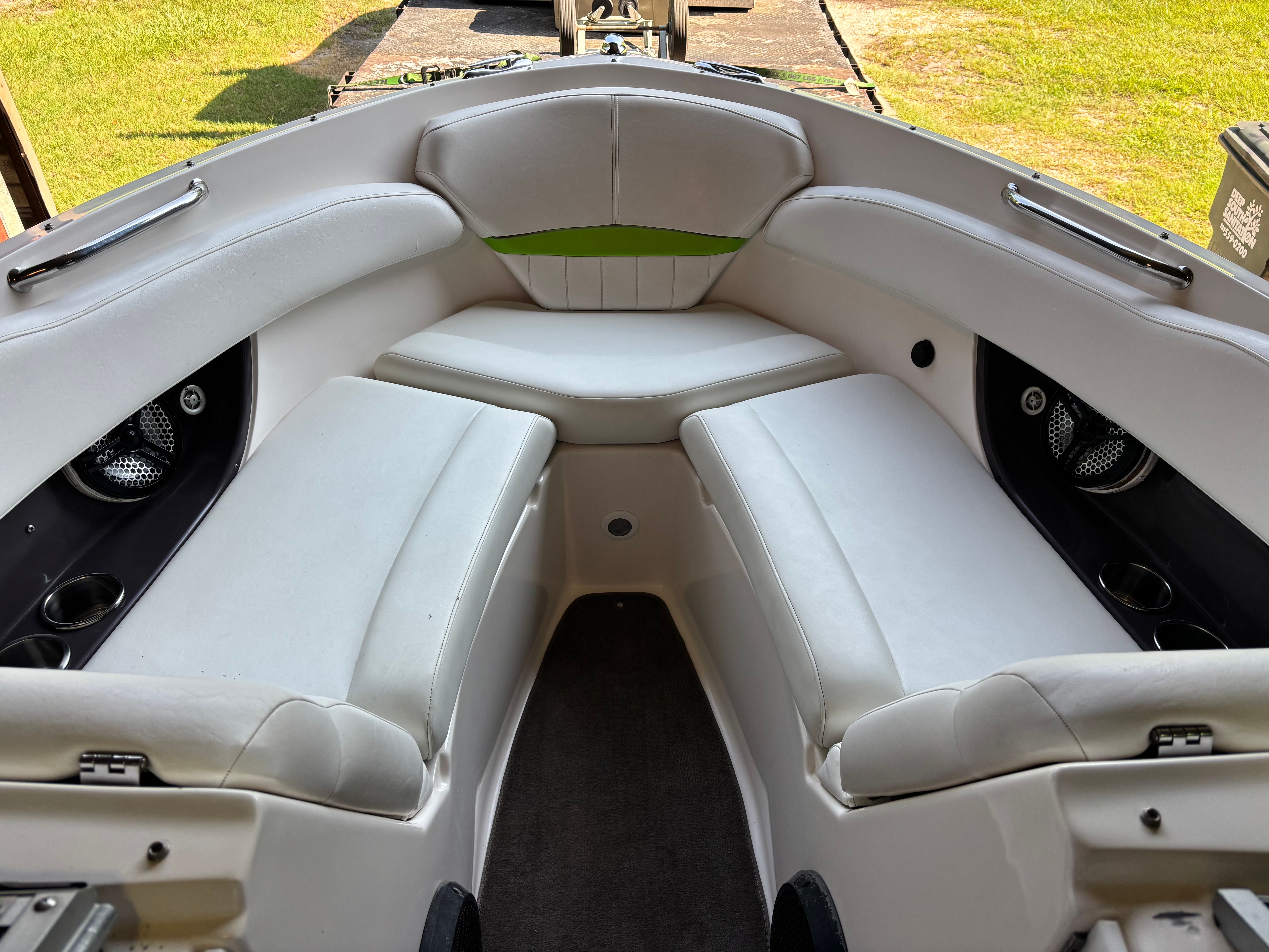 Interior view of a 2006 Regal 2200 Bowrider with white cushioned seating.